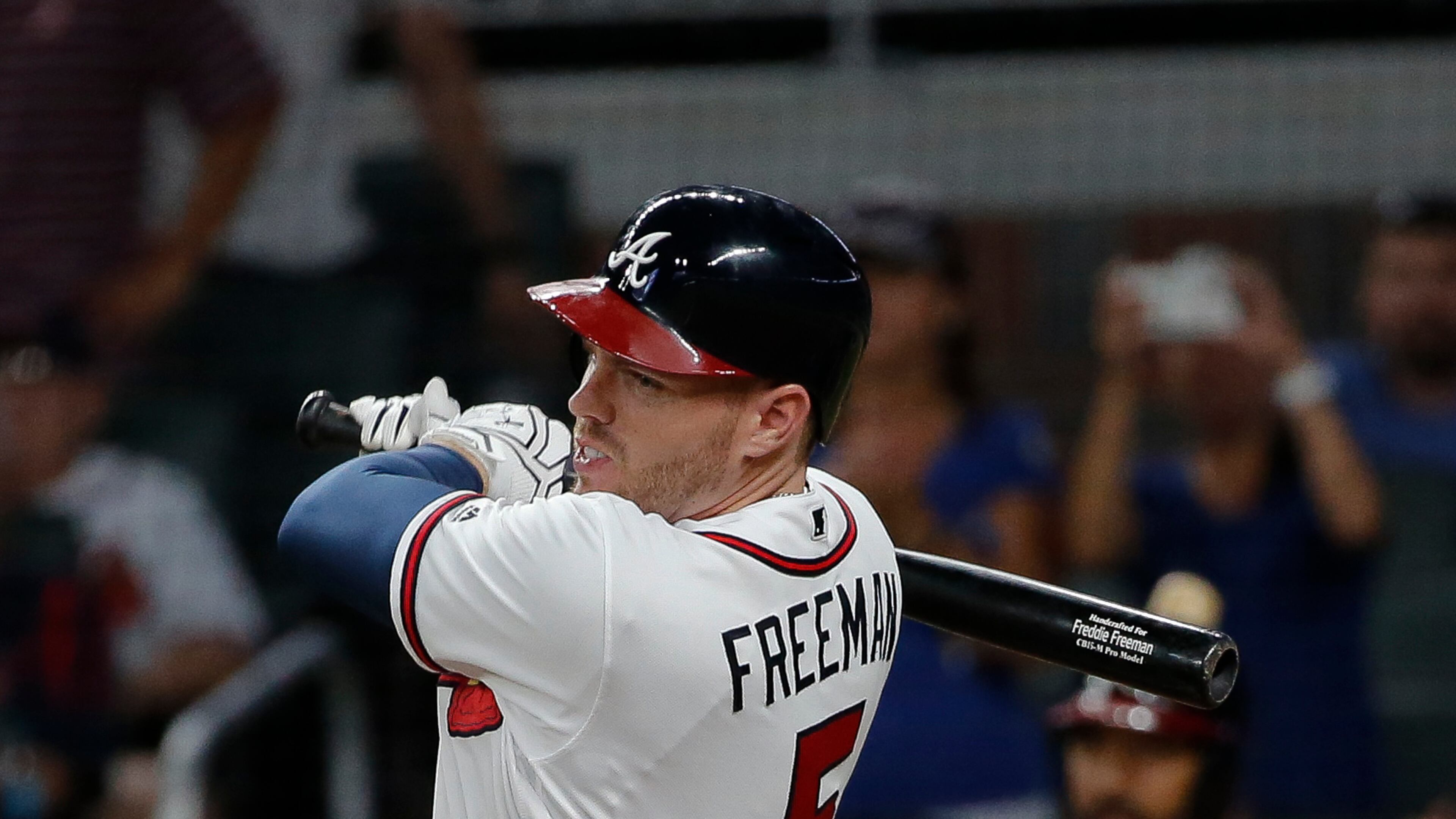 Braves’ Freddie Freeman follows through on his game-winning hit in the eighth inning. (AP Photo/John Bazemore)