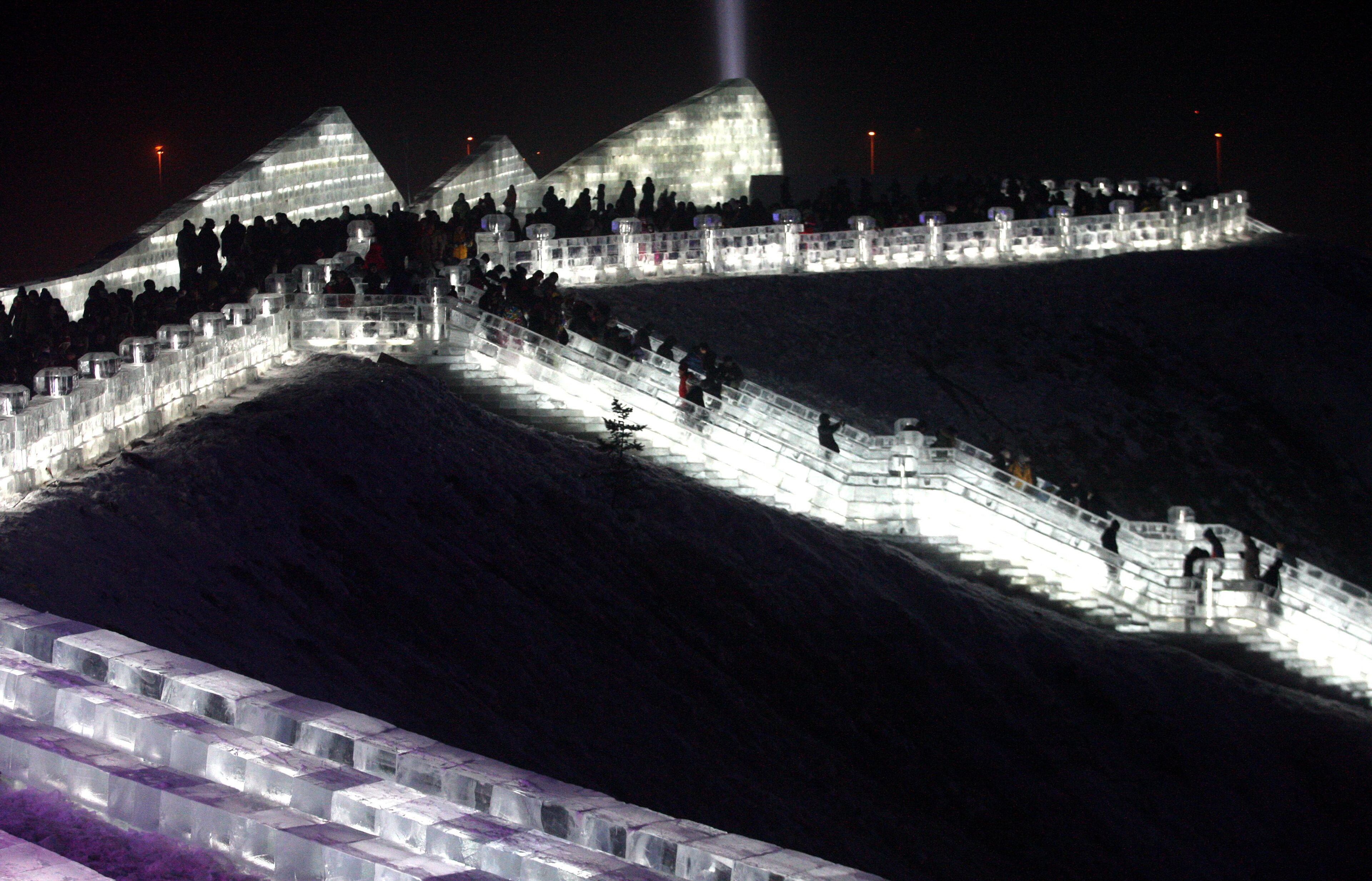HARBIN, CHINA - DECEMBER 22: (CHINA OUT) Tourists play in the Harbin Ice And Snow World during its test run on December 22, 2015 in Harbin, Heilongjiang Province of China. The 17th Harbin Ice And Snow World would run from December 25, 2015 to February 25, 2016. (Photo by ChinaFotoPress/ChinaFotoPress via Getty Images)