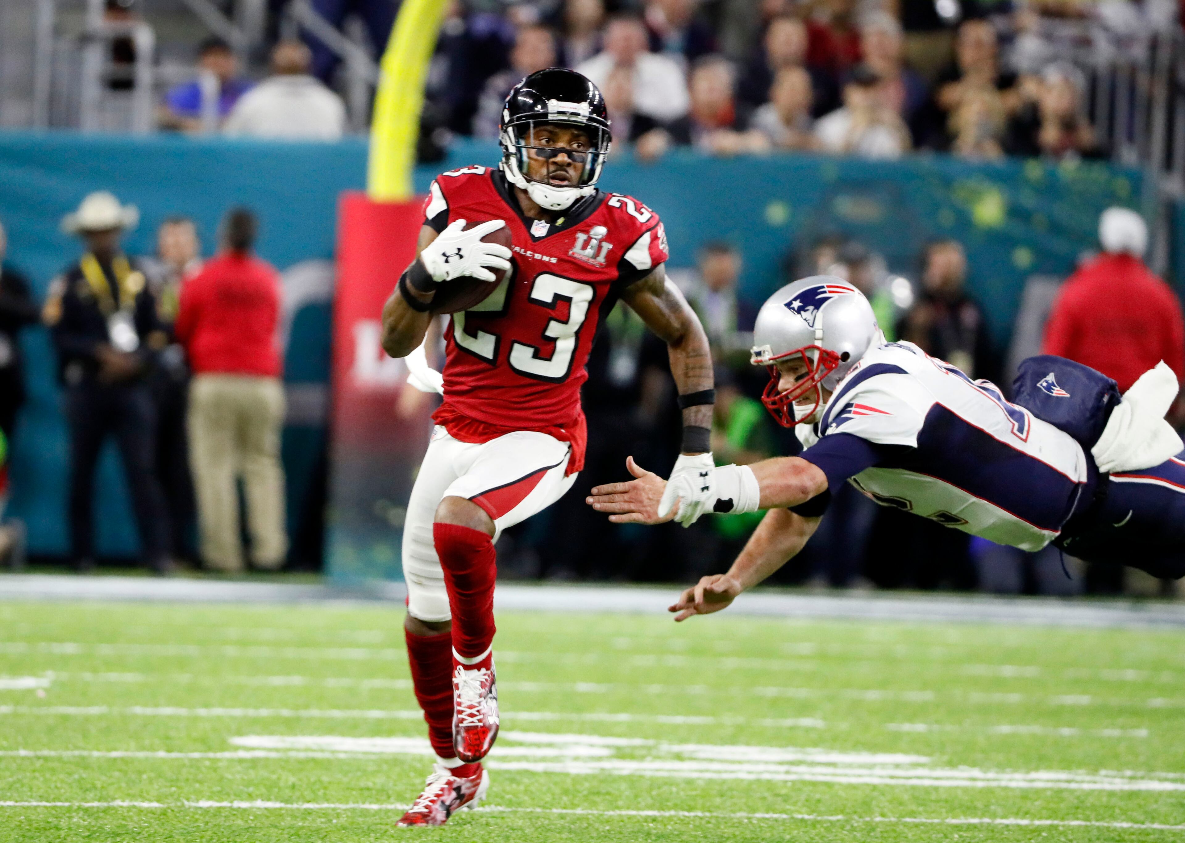 FEBRUARY 5, 2017 HOUSTON TX Atlanta Falcons cornerback Robert Alford (23) leaves New England Patriots quarterback Tom Brady (12) in his wake as he runs an interception back for touchdown in the second quarter as the Atlanta Falcons meet the New England Patriots in Super Bowl LI at NRG Stadium in Houston, TX, Sunday, February 5, 2017. Bob Andres/AJC