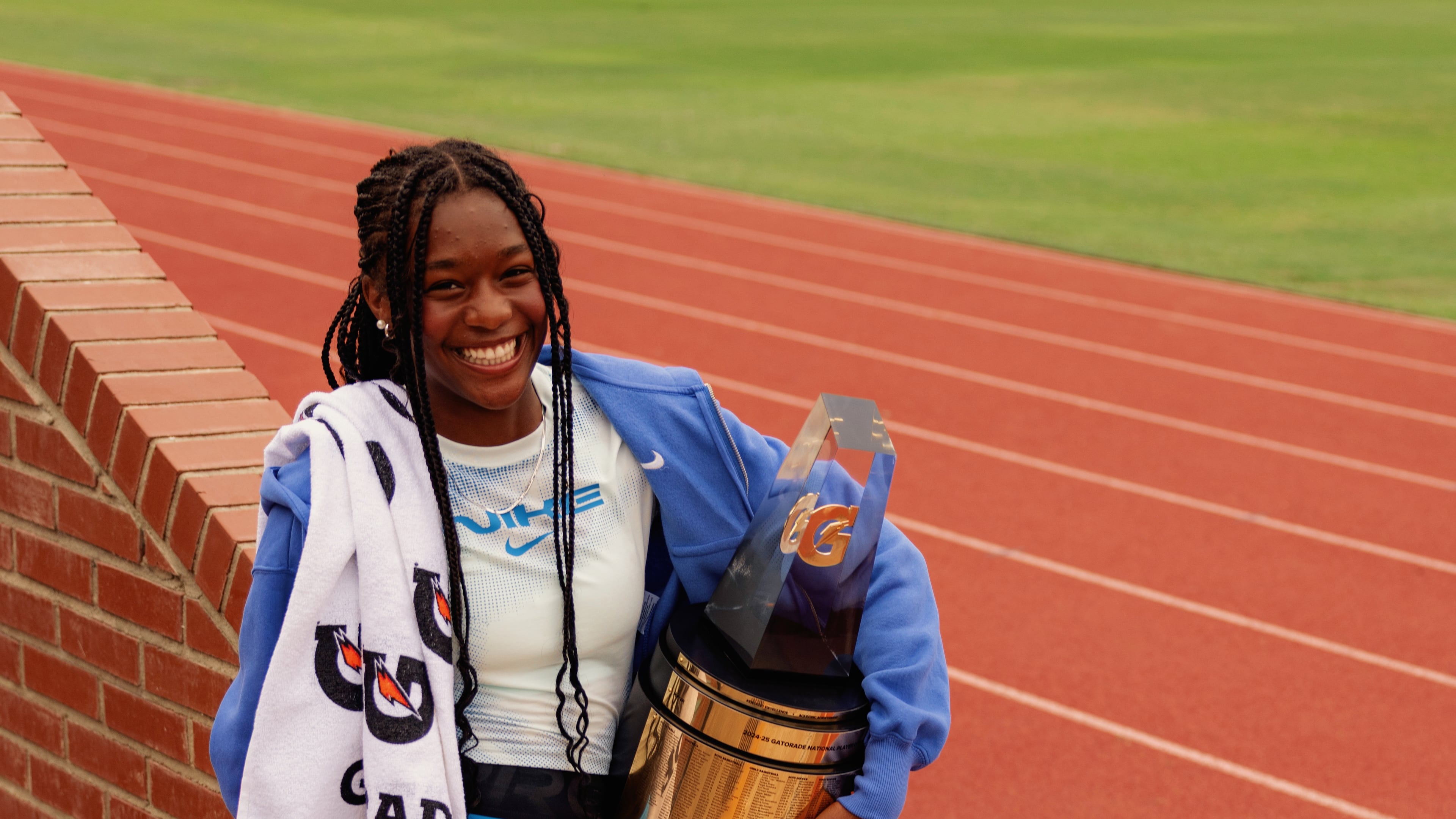 Melanie Doggett holds the Gatorade national girls track-and-field national athlete-of-the-year trophy, presented to her at her school, Landmark Christian, on Thursday. (Courtesy of Gatorade)