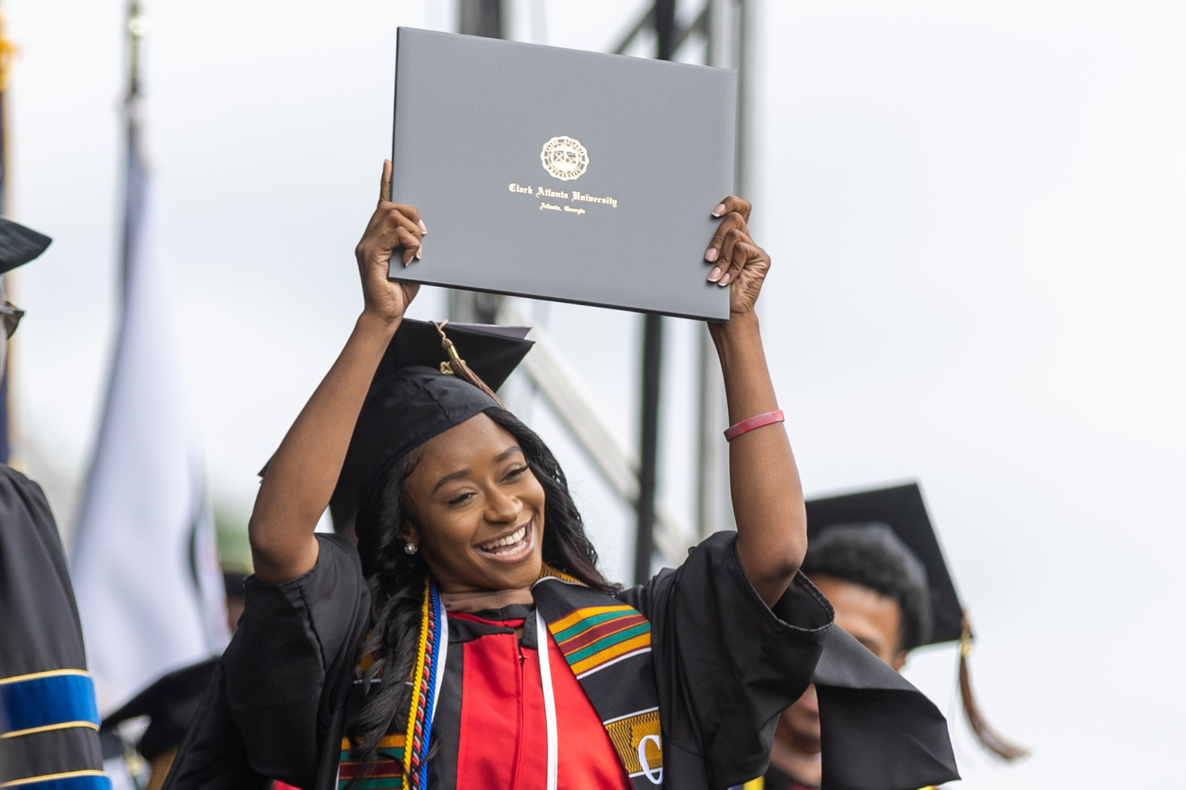 Jangi McKenzie celebrates after receiving her degree during the Clark Atlanta University commencement ceremony in Panther Stadium on Saturday, May 20, 2023. (Steve Schaefer / steve.schaefer@ajc.com)