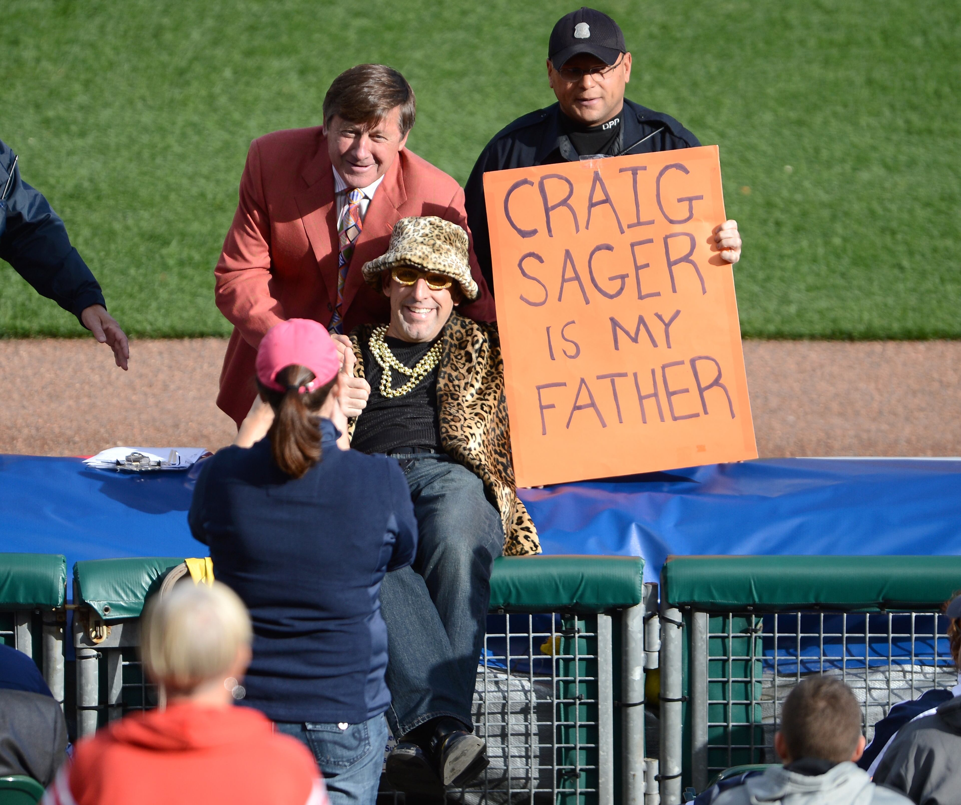 A fan poses with TBS analyst Craig Sager as the Detroit Tigers host the New York Yankees during game four of the American League Championship Series at Comerica Park on October 18, 2012 in Detroit, Michigan.