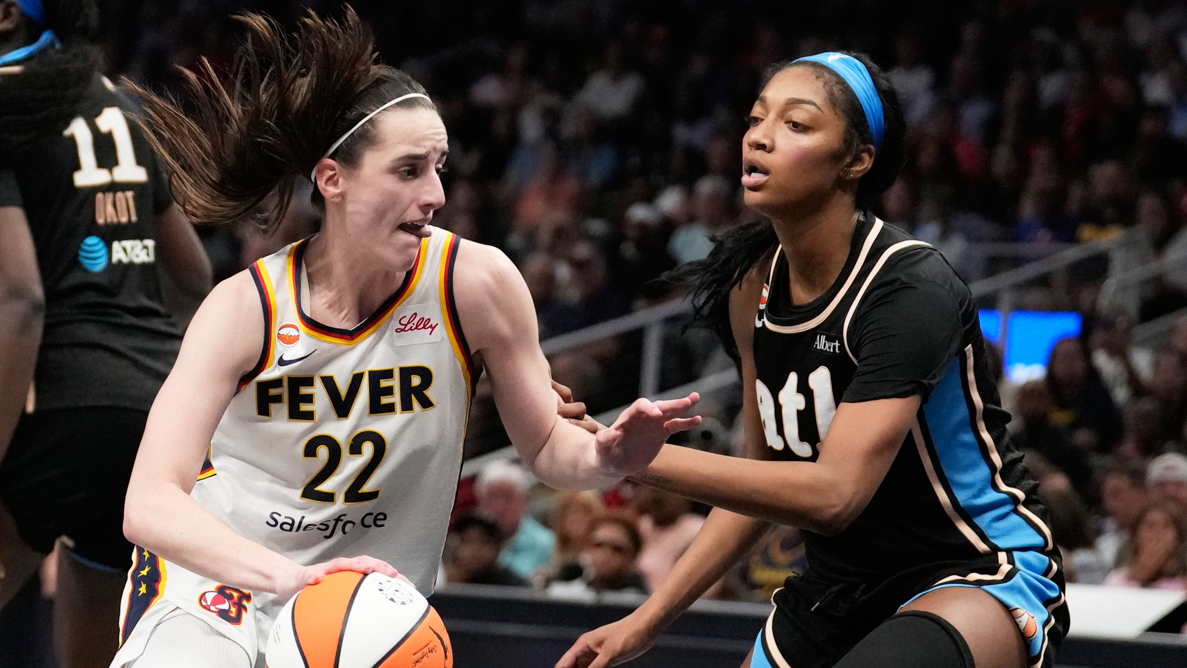 Indiana Fever's Caitlin Clark (22) dribbles the ball against Atlanta Dream forward Angel Reese (5) in the second half of an WNBA basketball game Sunday, Aug. 16, 2026, in Atlanta. (AP Photo/Brynn Anderson)