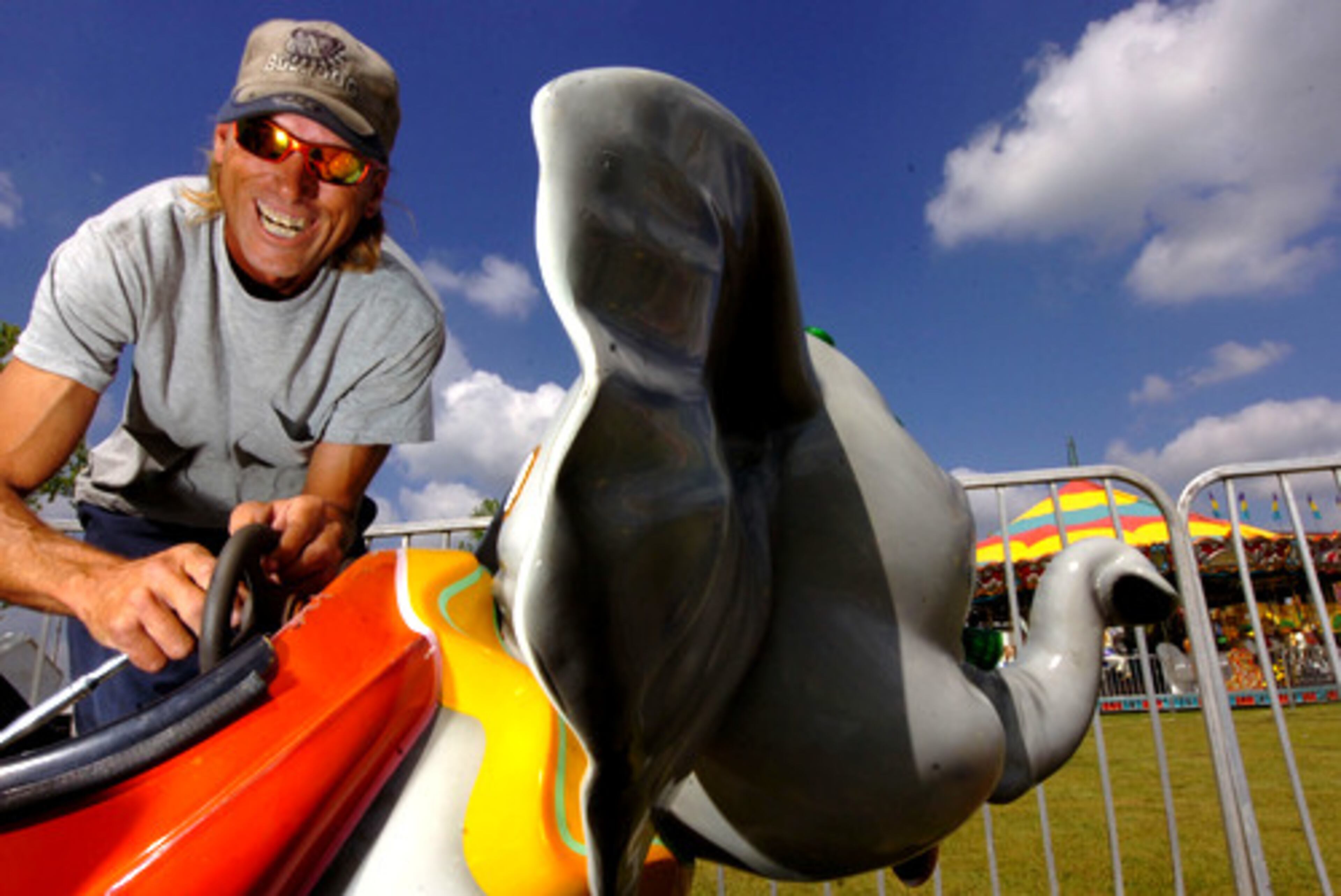 Michael Gray works on the elephant carnival ride. The circus features a full carnival presented by Myers International Midways with rides and games for children and adults.