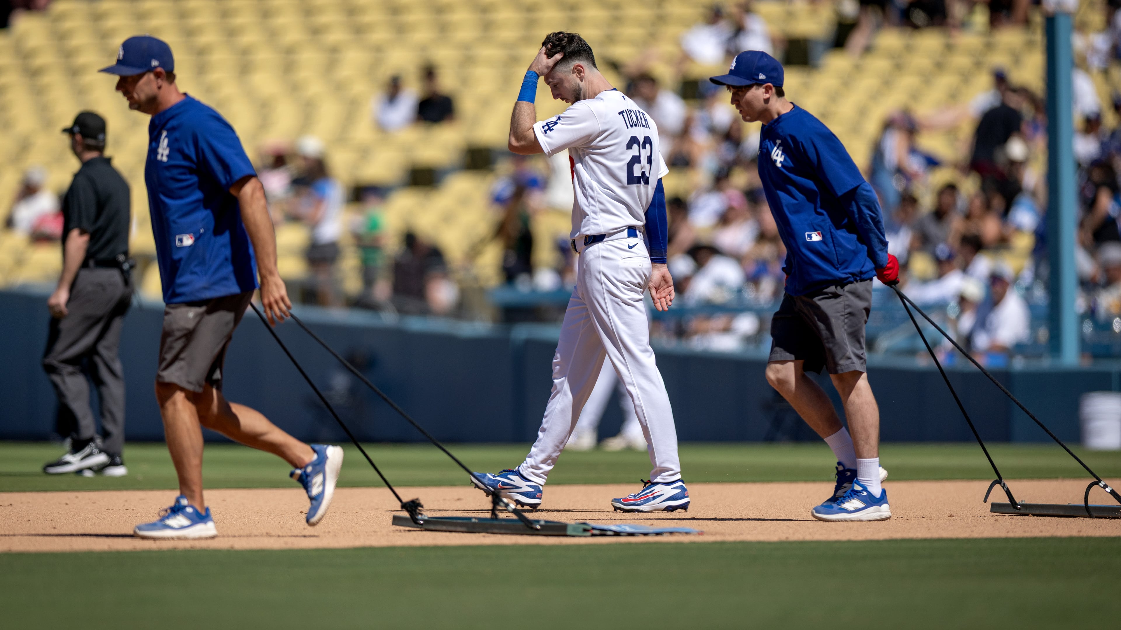 Los Angeles Dodgers' Kyle Tucker (23) walks to the outfield after grounding out during the seventh inning of a baseball game against the Milwaukee Brewers, Sunday, Aug. 16, 2026, in Los Angeles. (Eric Thayer/Los Angeles Times via AP)