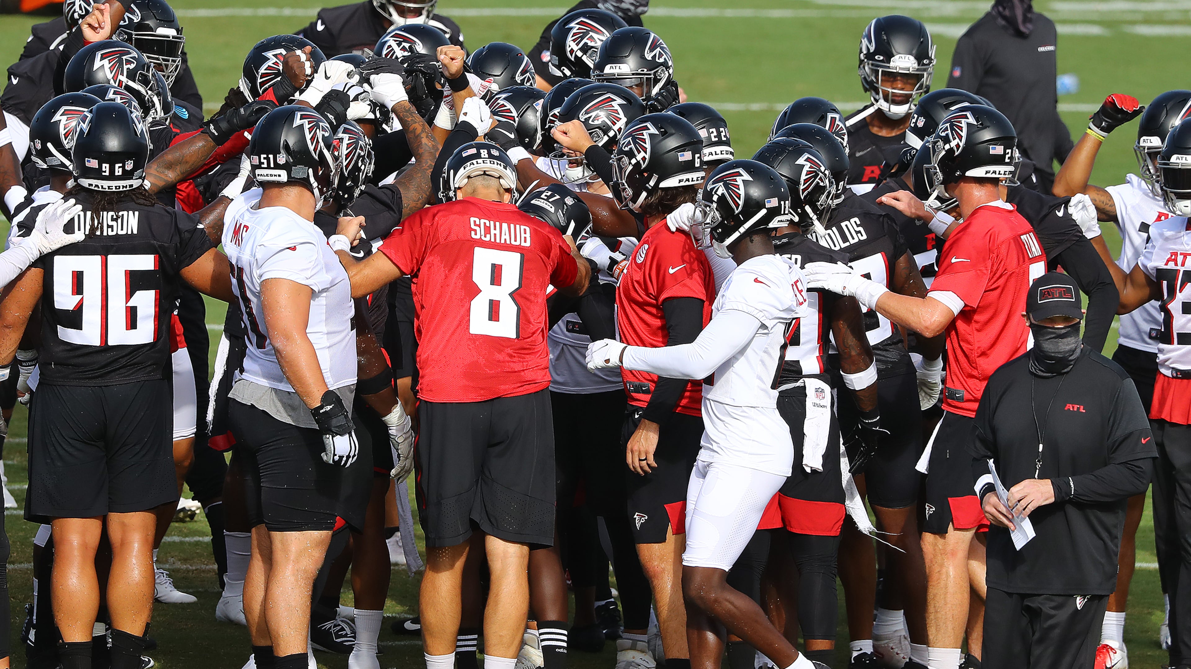 Falcons head coach Dan Quinn (bottom right) and his team take the field for training camp on Thursday, Aug. 27, 2020, in Flowery Branch.