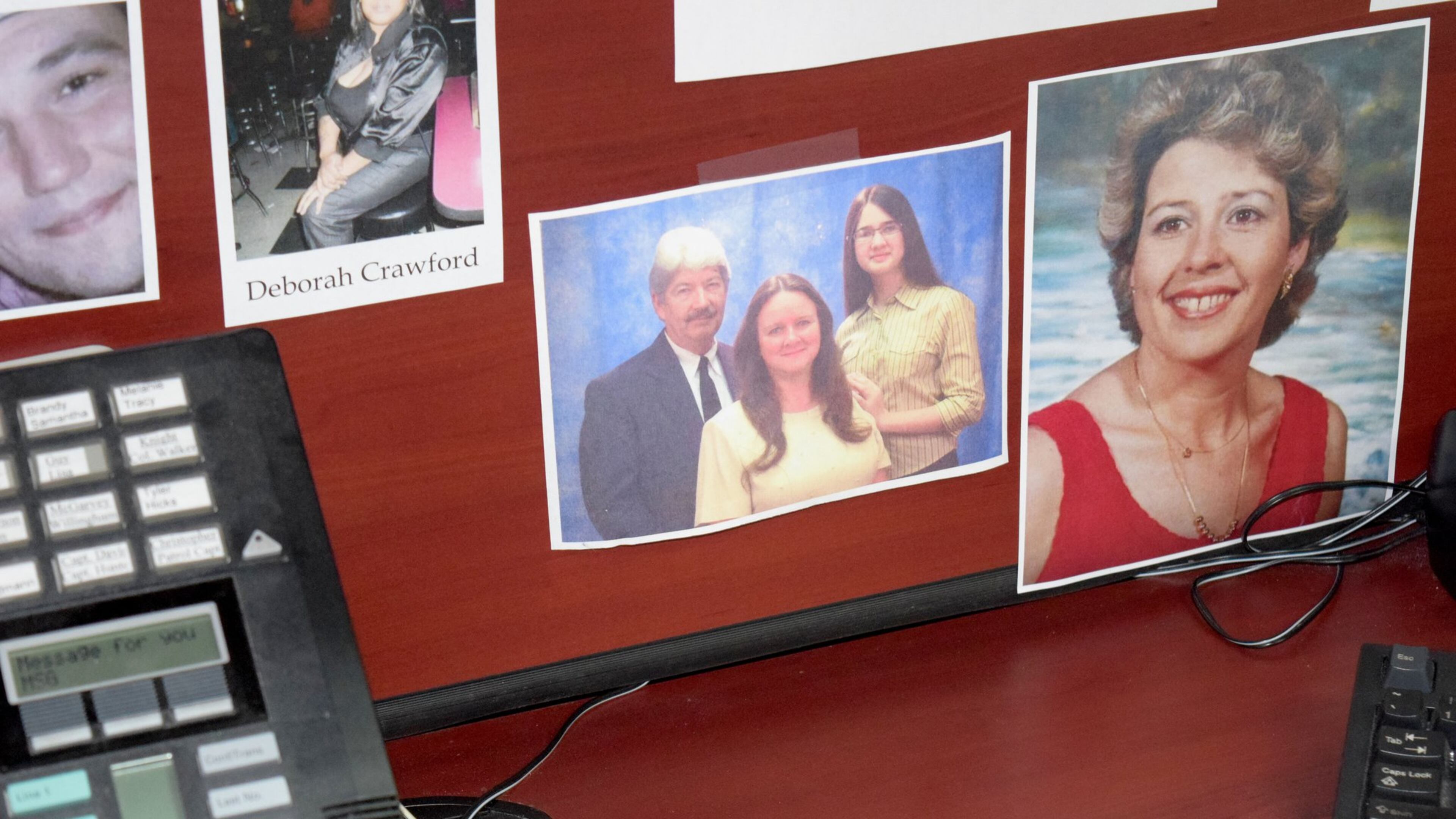Lt. Mike Hill keeps a photo of Regan Wheeler on his desk at the Paulding County Sheriff’s Office, along with victims of other unsolved homicides. (Photo: Alexis Stevens/astevens@ajc.com)