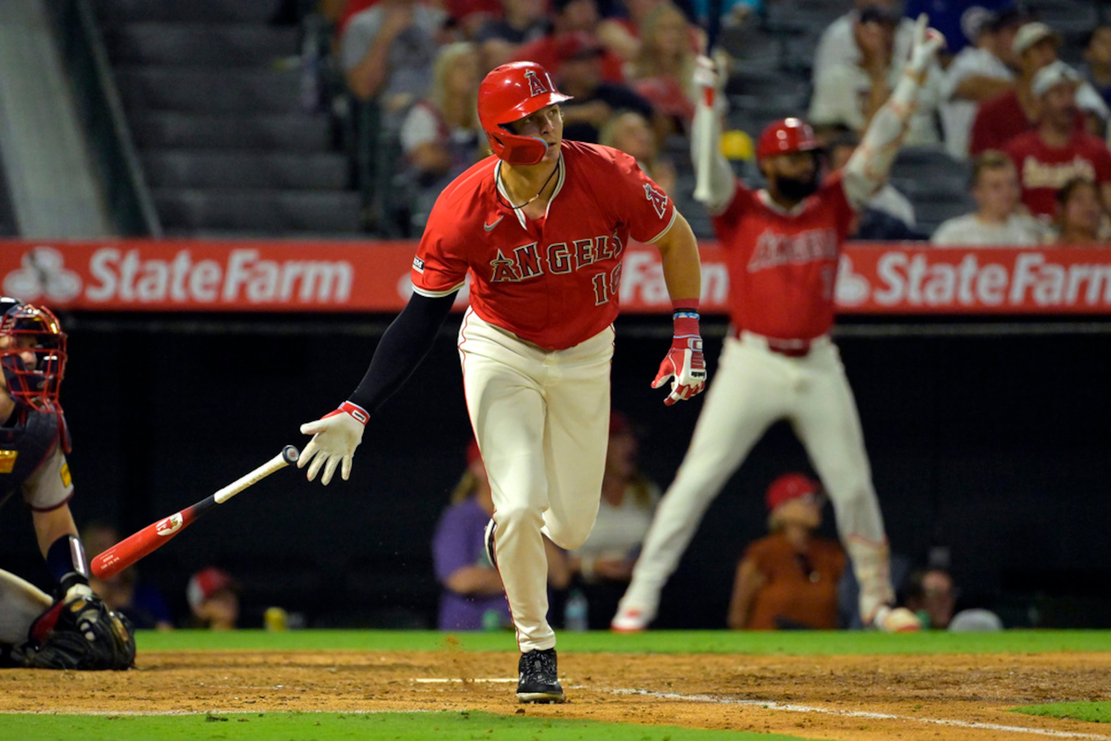 Los Angeles Angels' Mickey Moniak, front right, doubles in a run in the sixth inning of a baseball game against the Atlanta Braves, Friday, Aug. 16, 2024, in Anaheim, Calif. (AP Photo/Jayne Kamin-Oncea)