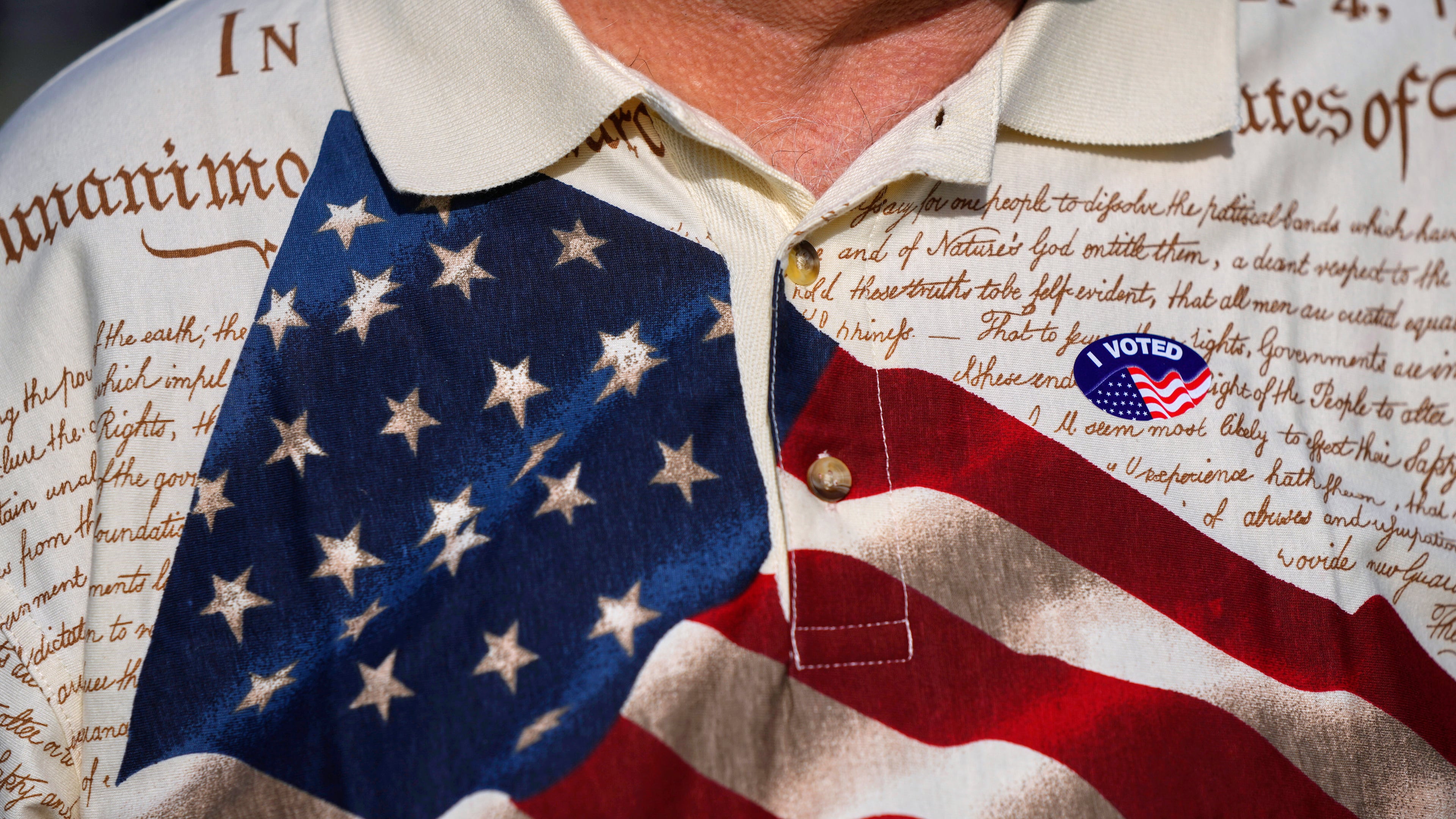 FILE - A man wears an "I voted" sticker on his shirt, printed with the American flag and the U.S. constitution, after voting at Wa-Ke Hatchee Recreation Center in Fort Myers, Fla, on Election Day, Nov. 8, 2022. (AP Photo/Rebecca Blackwell, File)