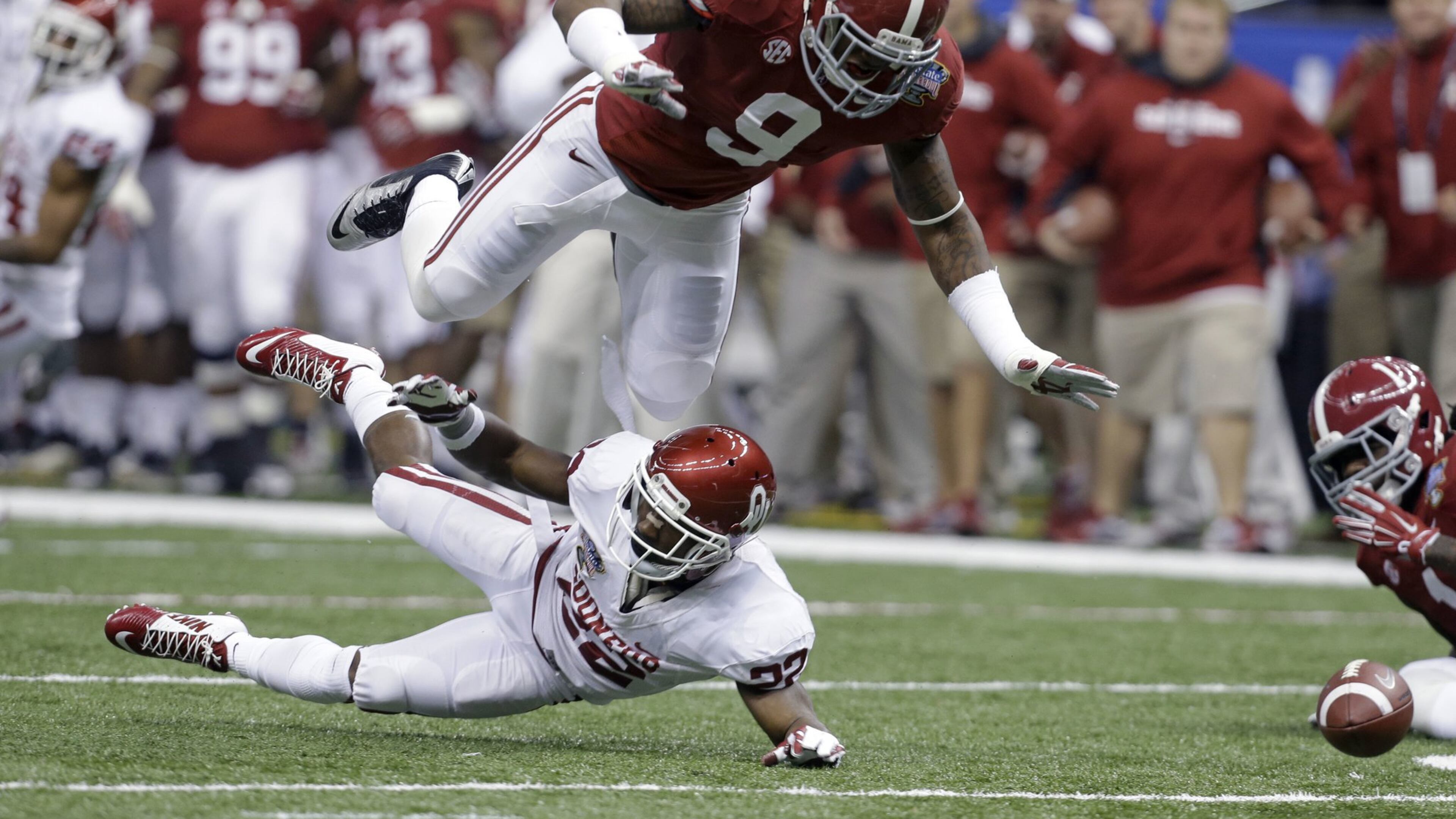 Alabama middle linebacker Reuben Foster (9), planting Oklahoma running back Roy Finch, nearly fell out of the first round before San Francisco called his name. CREDIT: Rusty Costanza/AP