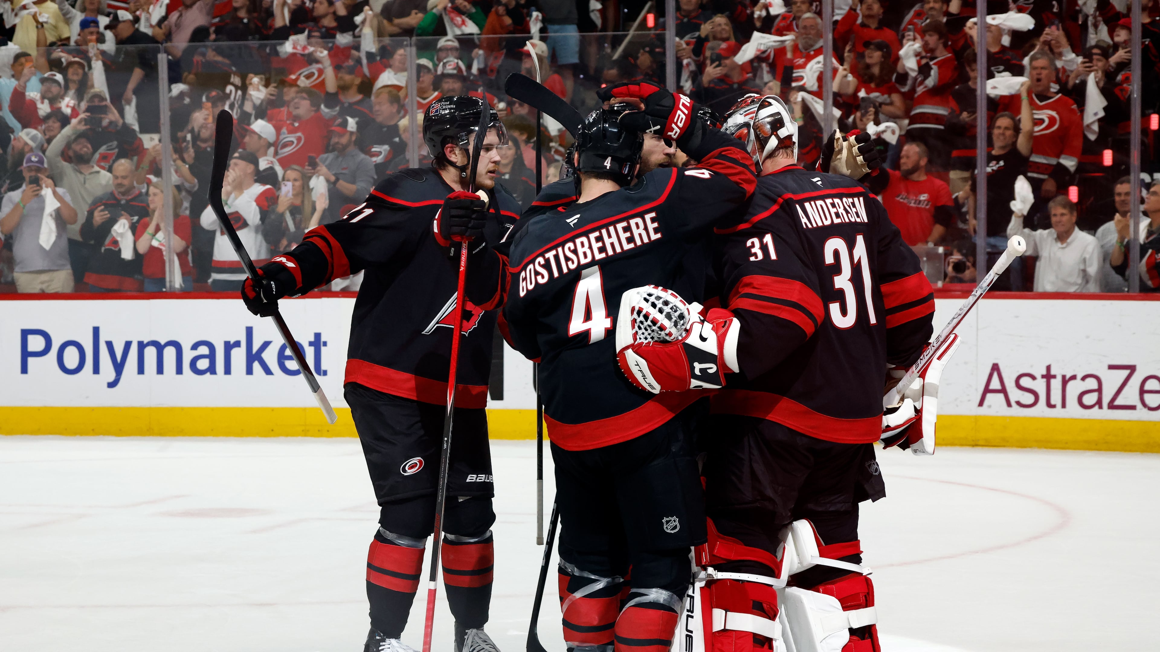 Carolina Hurricanes players join goaltender Frederik Andersen (31) following Game 5 of the Eastern Conference finals NHL hockey Stanley Cup playoff series against the Montreal Canadiens in Raleigh, N.C., Friday, May 29, 2026. (AP Photo/Karl DeBlaker)