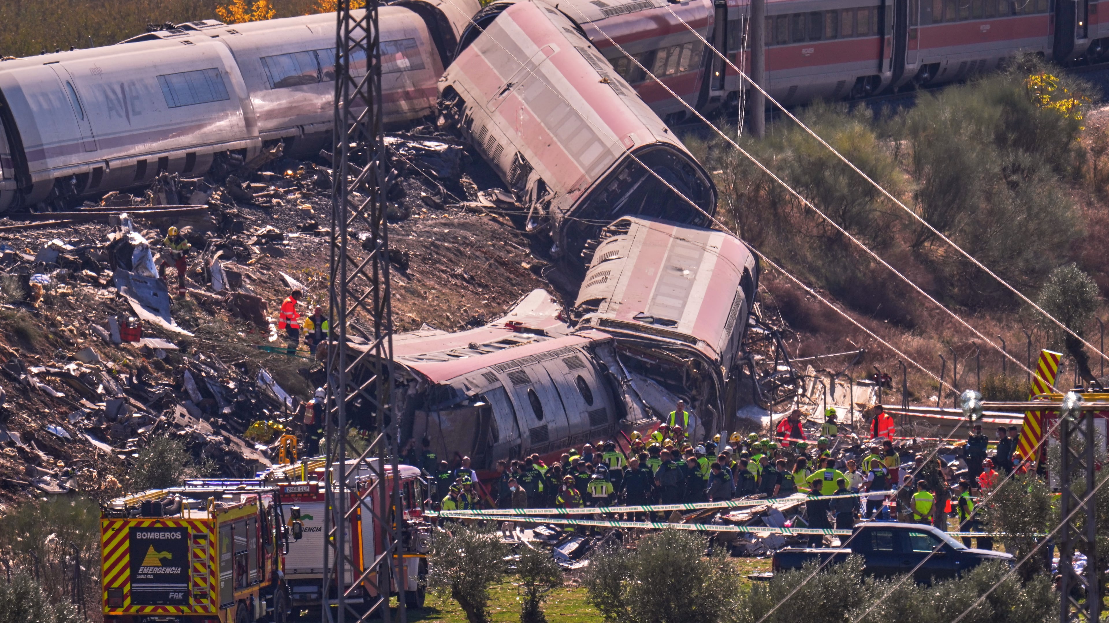 Emergency services work at the scene of a collision between two trains in Urda, Spain, on Wednesday, Oct. 28, 2026. (AP Photo/Manu Fernandez)
