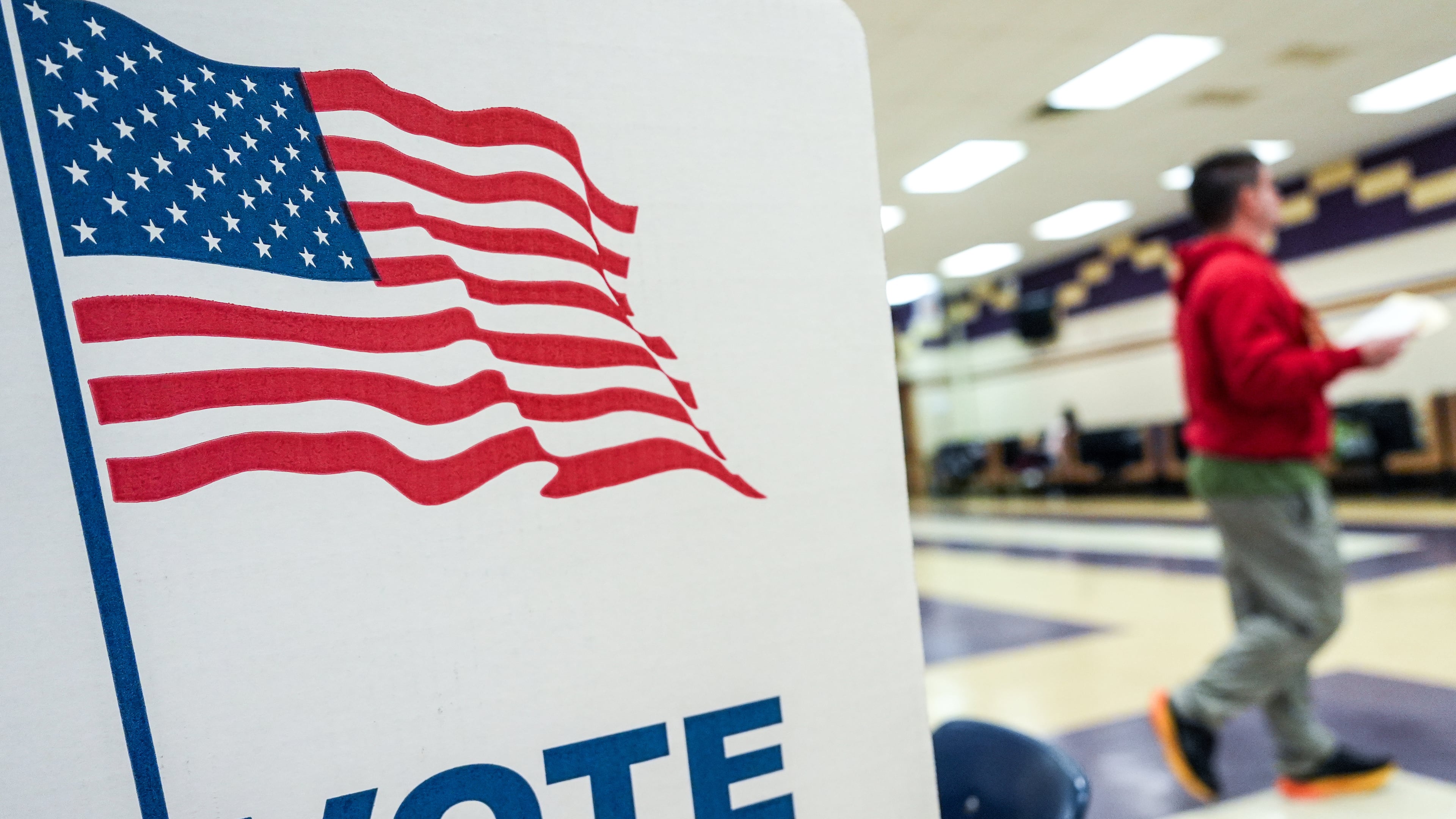 A person votes in the Virginia redistricting referendum at Lake Braddock Secondary School, Tuesday, April 21, 2026, in Burke, Va. (AP Photo/Julia Demaree Nikhinson)