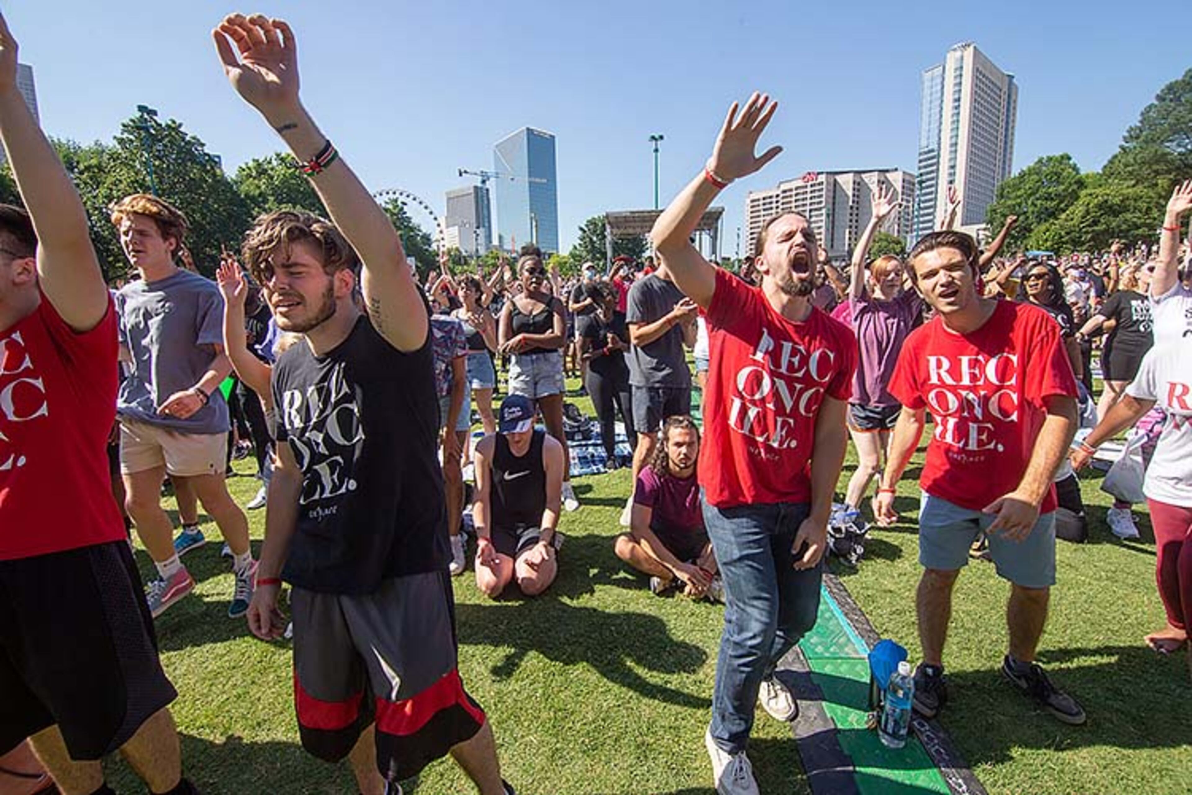 A large crowd gathers at the Centennial Olympic Park stage for an OneRace prayer and worship before marching to the State Capital Friday, June 19, 2020. STEVE SCHAEFER FOR THE ATLANTA JOURNAL-CONSTITUTION