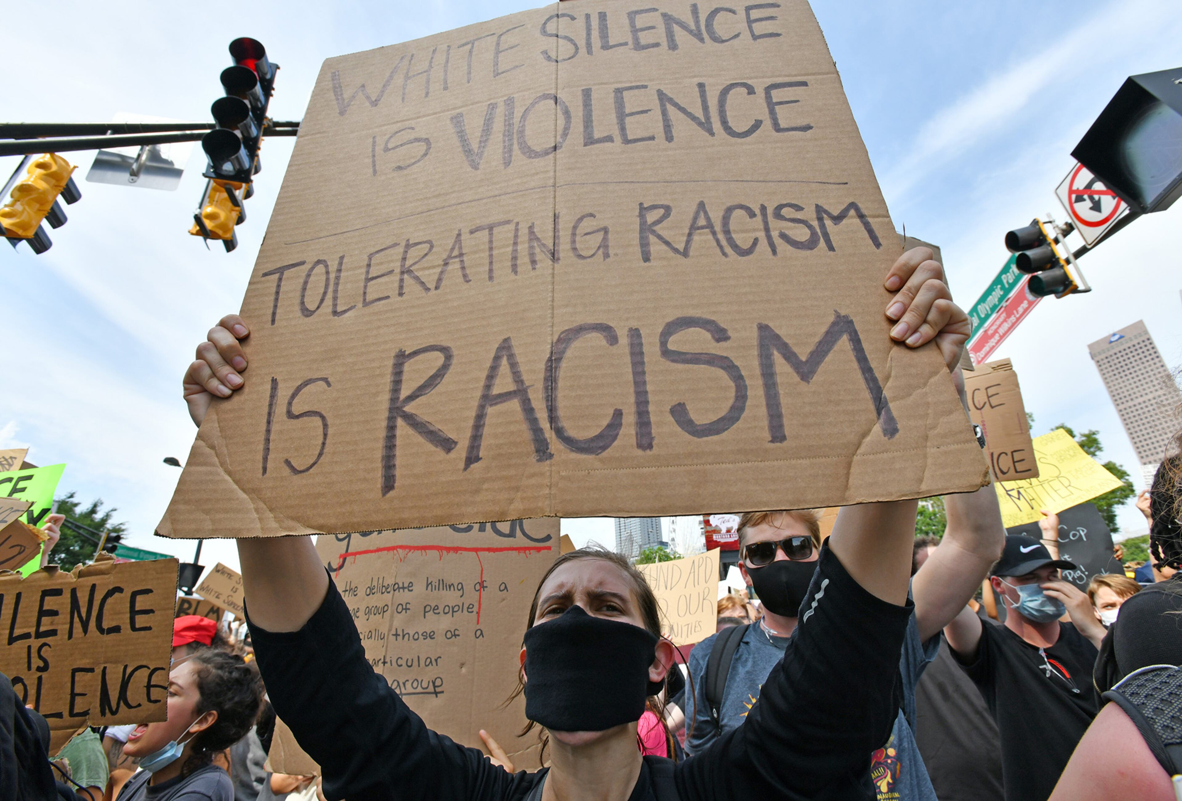 June 3, 2020 Atlanta - Protesters holding signs chant during the sixth consecutive day of protest against police brutality and racism at Centennial Olympic Park on Wednesday, June 3, 2020. The curfew for the city of Atlanta was extended for the next five days, going into effect at 9 p.m. Wednesday. (Hyosub Shin / Hyosub.Shin@ajc.com)