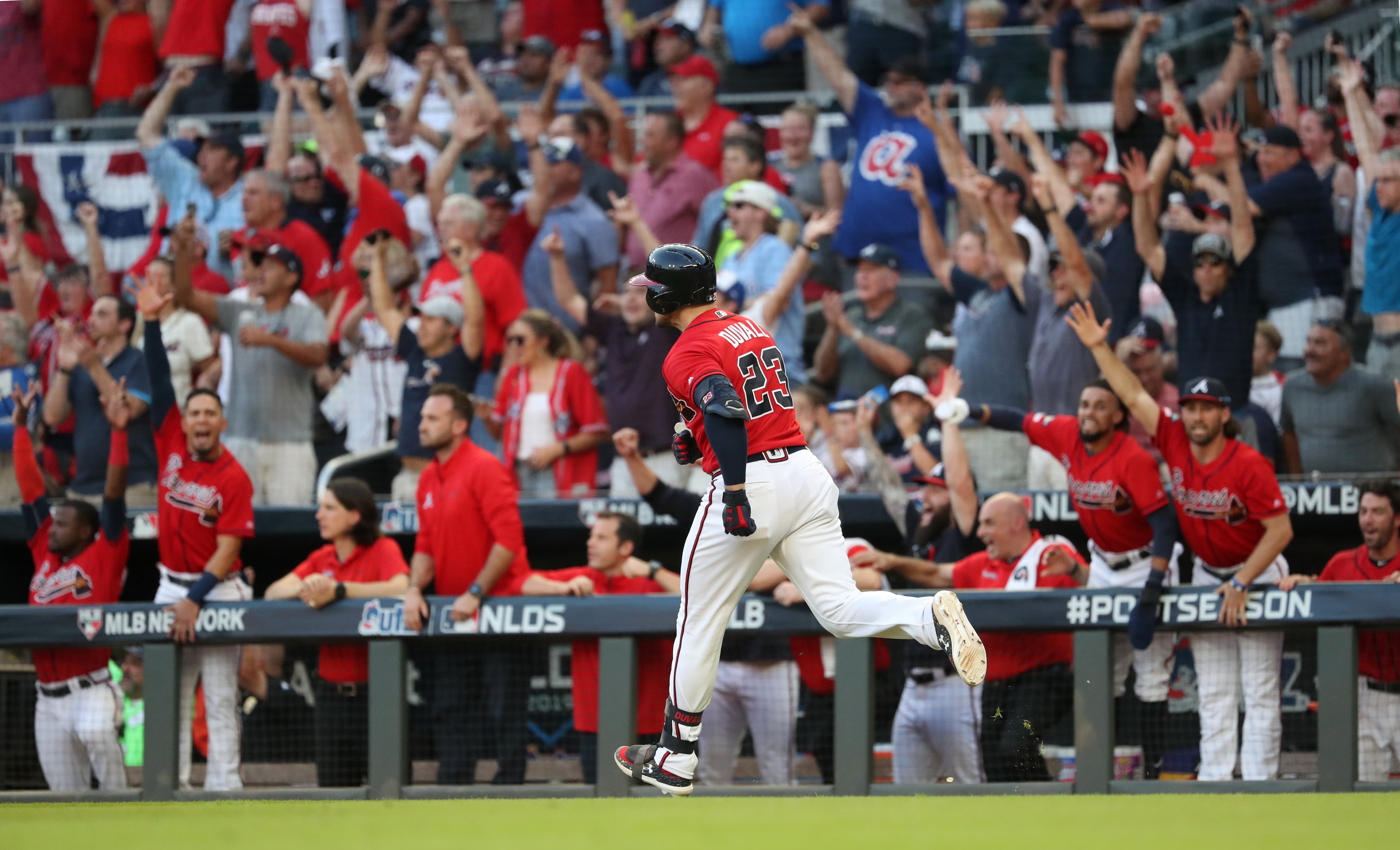 Braves left fielder Adam Duvall (23) reacts after hitting a two-run home run in the seventh inning. (JASON GETZ/SPECIAL TO THE AJC)