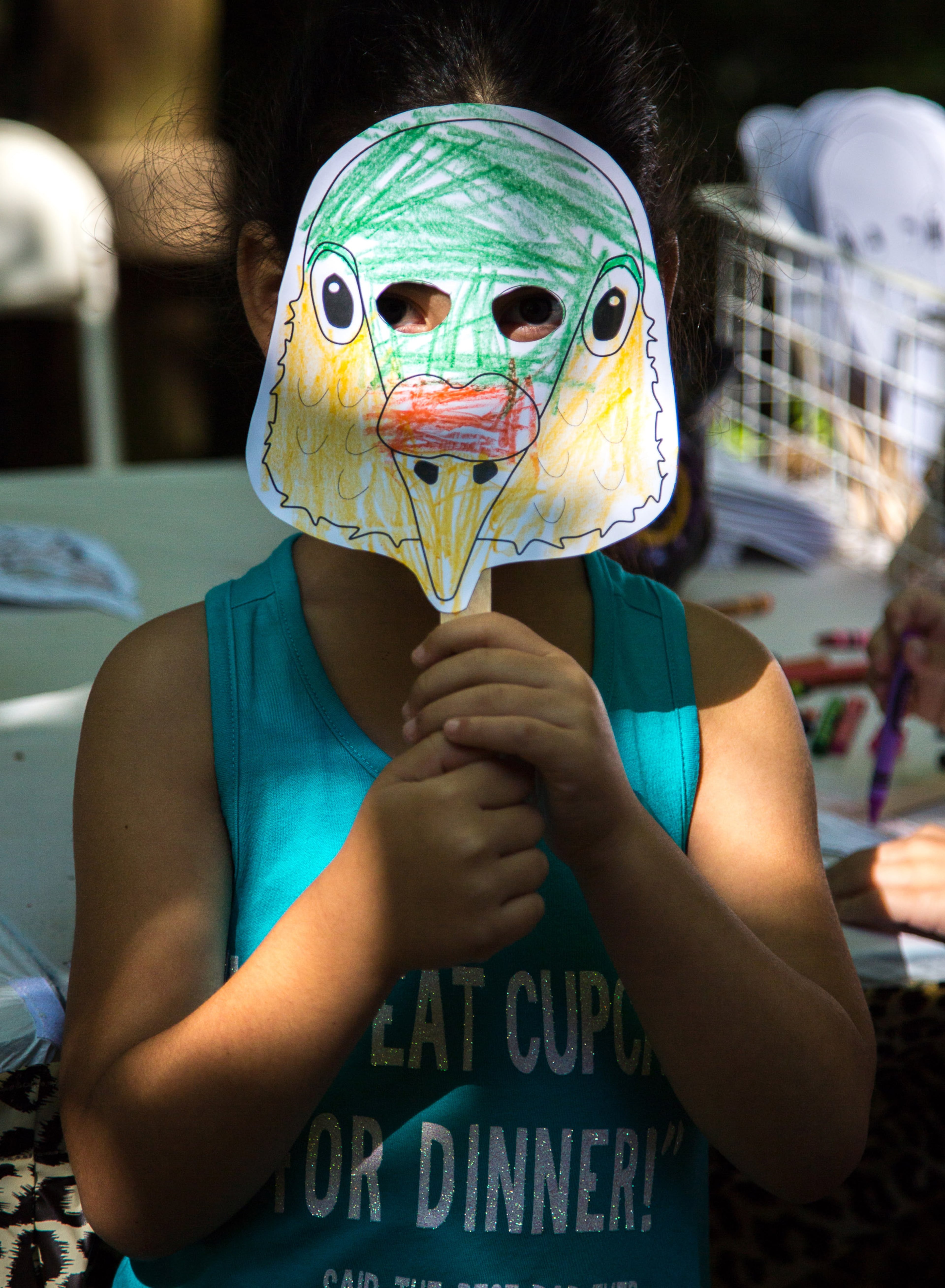 Hannah Williams holds up her freshly colored Mourning Dove bird mask at Bird Fest, an event celebrating the Migratory Bird Treaty at Zoo Atlanta Saturday, April 23, 2016. Zoo Atlanta joined up with the U.S. Fish and Wildlife Service to celebrate the 100 year anniversary of the treaty. STEVE SCHAEFER / SPECIAL TO THE AJC