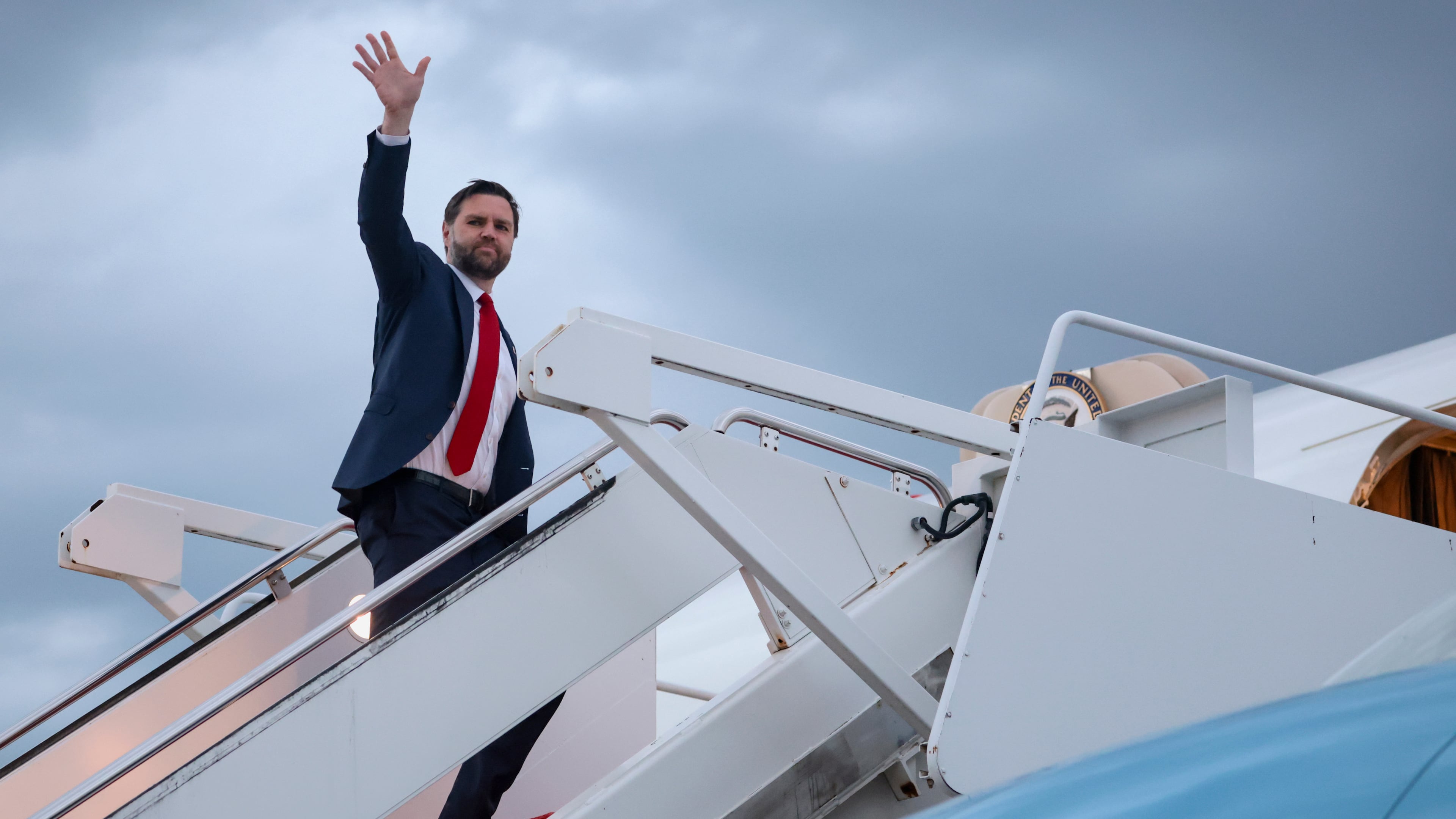 Vice President JD Vance waves as he boards Air Force Two to depart for Budapest, at Joint Base Andrews, Md., Monday, April 6, 2026. (Jonathan Ernst/Pool via AP)