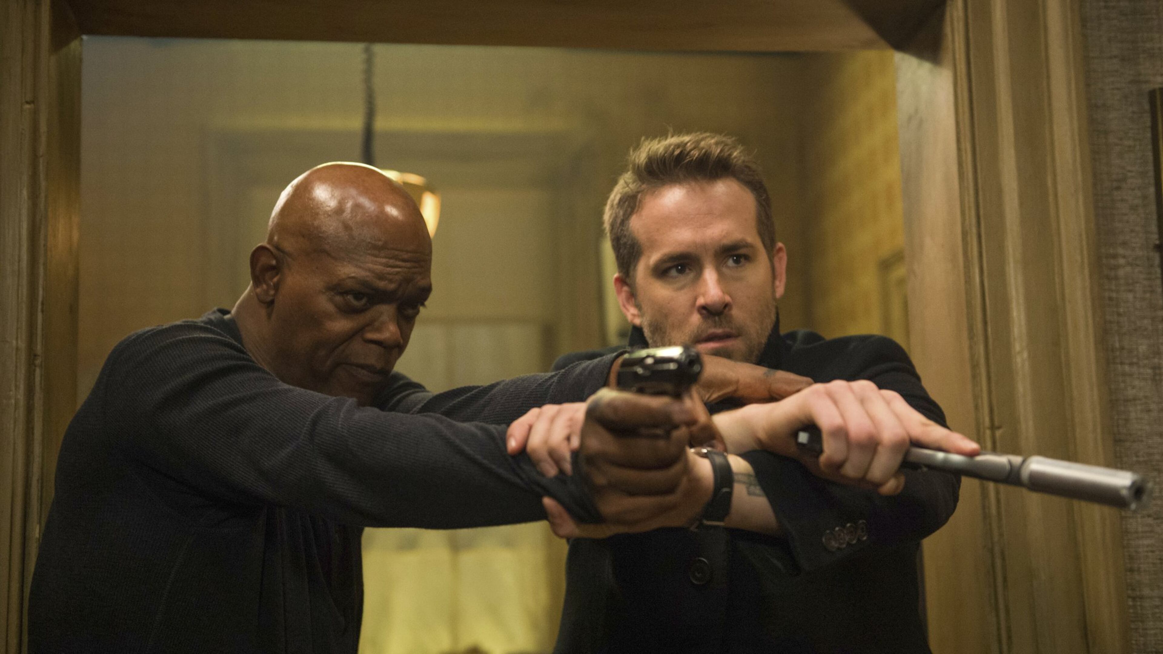 Samuel L. Jackson, left, and Ryan Reynolds star in “The Hitman’s Bodyguard.” Contributed by Jack English/Lionsgate via AP