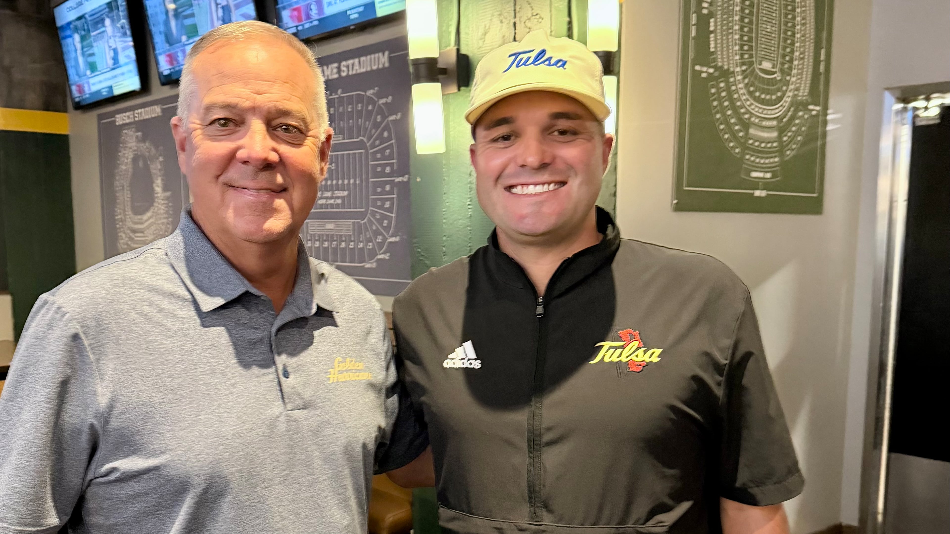 Longtime Calhoun coach Hal Lamb (left) poses with his son Tre Lamb, now head coach at the University of Tulsa.