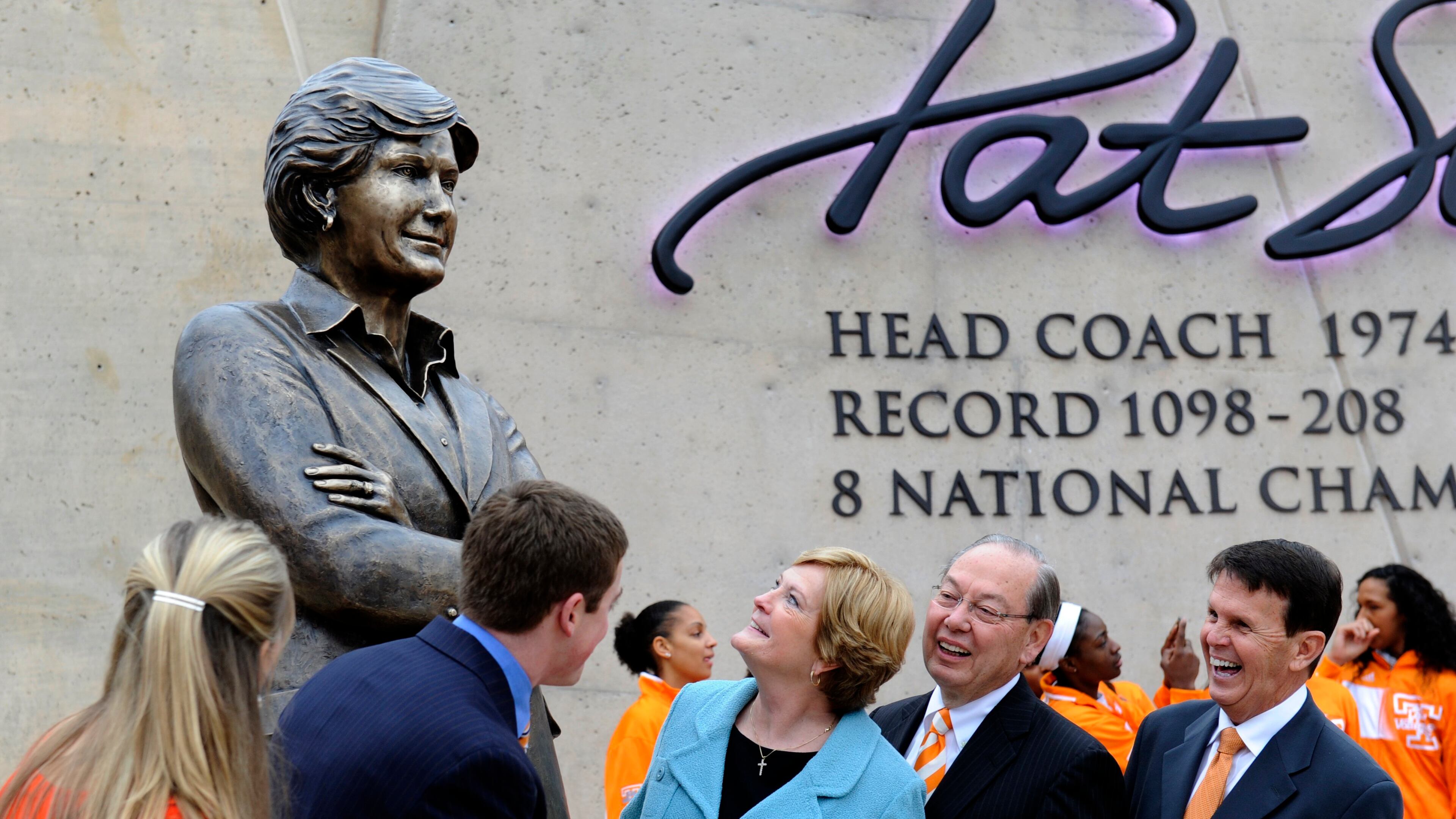 In this Nov. 22, 2013, file photo, Tennessee women's basketball coach emeritus Pat Summitt, center, looks at the statue unveiled in her honor, in Knoxville, Tenn. With Summitt are, from left, her daughter-in-law AnDe Summitt, son Tyler Summitt, UT Chancellor Jimmy Cheek, and director of athletics Dave Hart. Summitt, the winningest coach in Division I college basketball history who uplifted the women's game from obscurity to national prominence during her career at Tennessee, died Tuesday morning, June 28, 2016. She was 64. (Michael Patrick/Knoxville News Sentinel via AP)