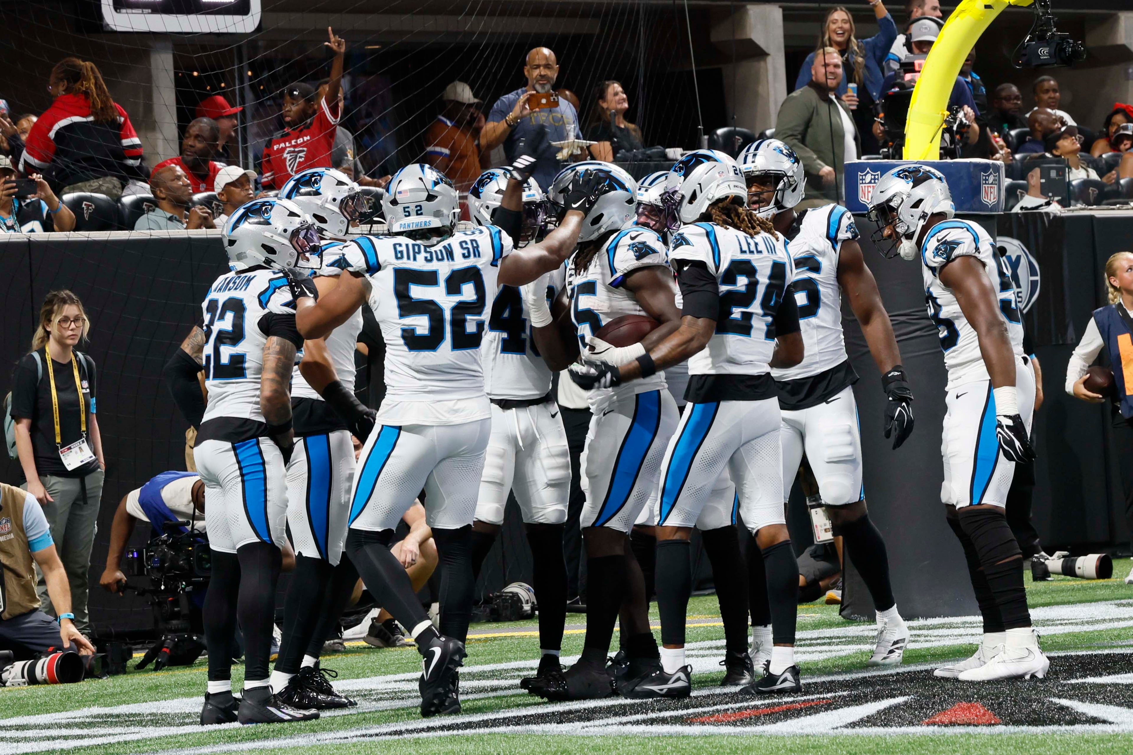 Carolina Panthers players celebrate after a touchdown following a fumble recover from Atlanta Falcons quarterback Jack Strand (18) during the second half of an NFL football game at Mercedes-Benz Stadium in Atlanta on Sunday, Sept. 20, 2026. (Miguel Martinez/AJC)
