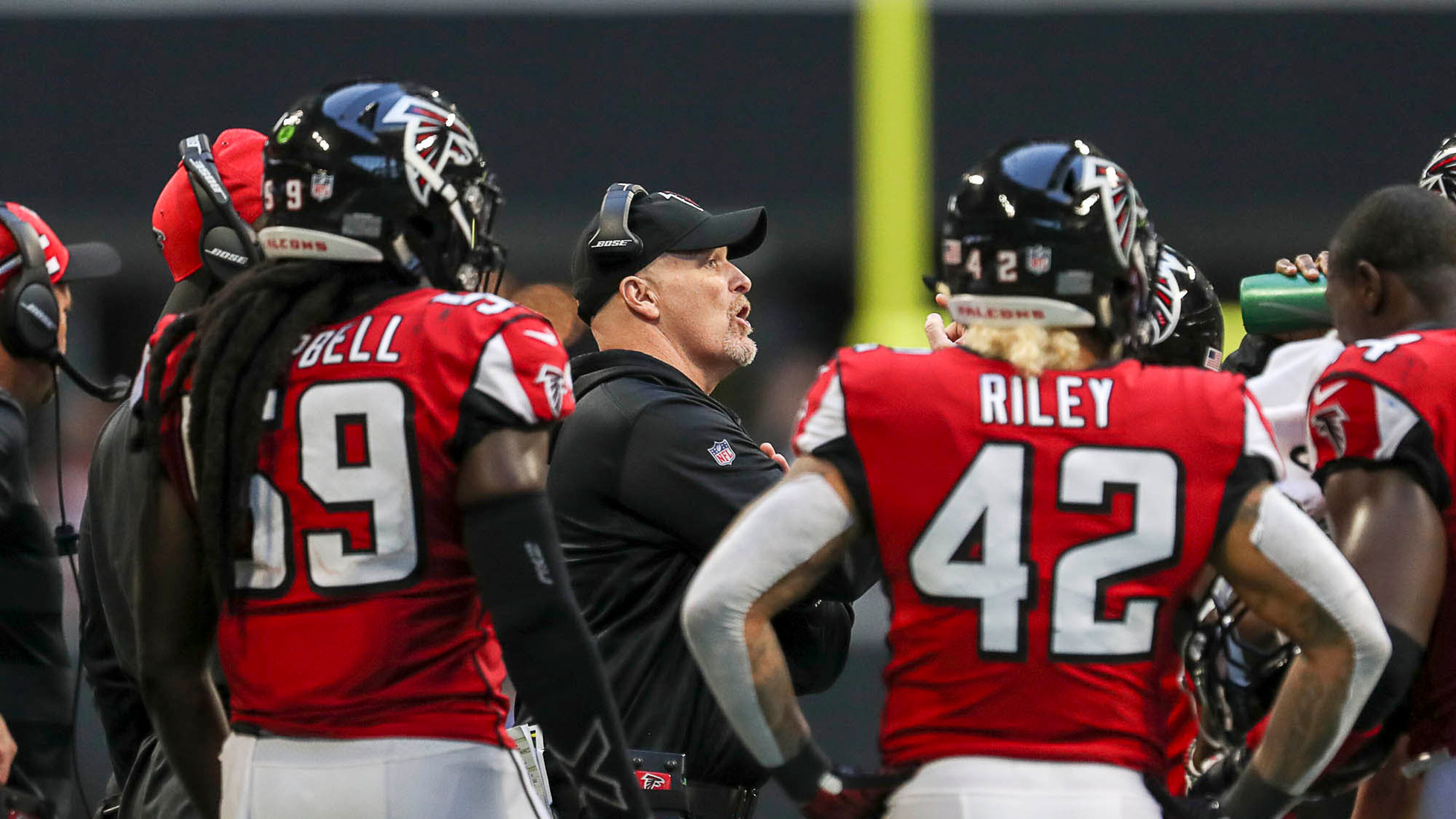 Atlanta Falcons head coach Dan Quinn speaks with his team during the second half of the game Sunday, Dec. 2, 2018, at Mercedes-Benz Stadium in Atlanta.