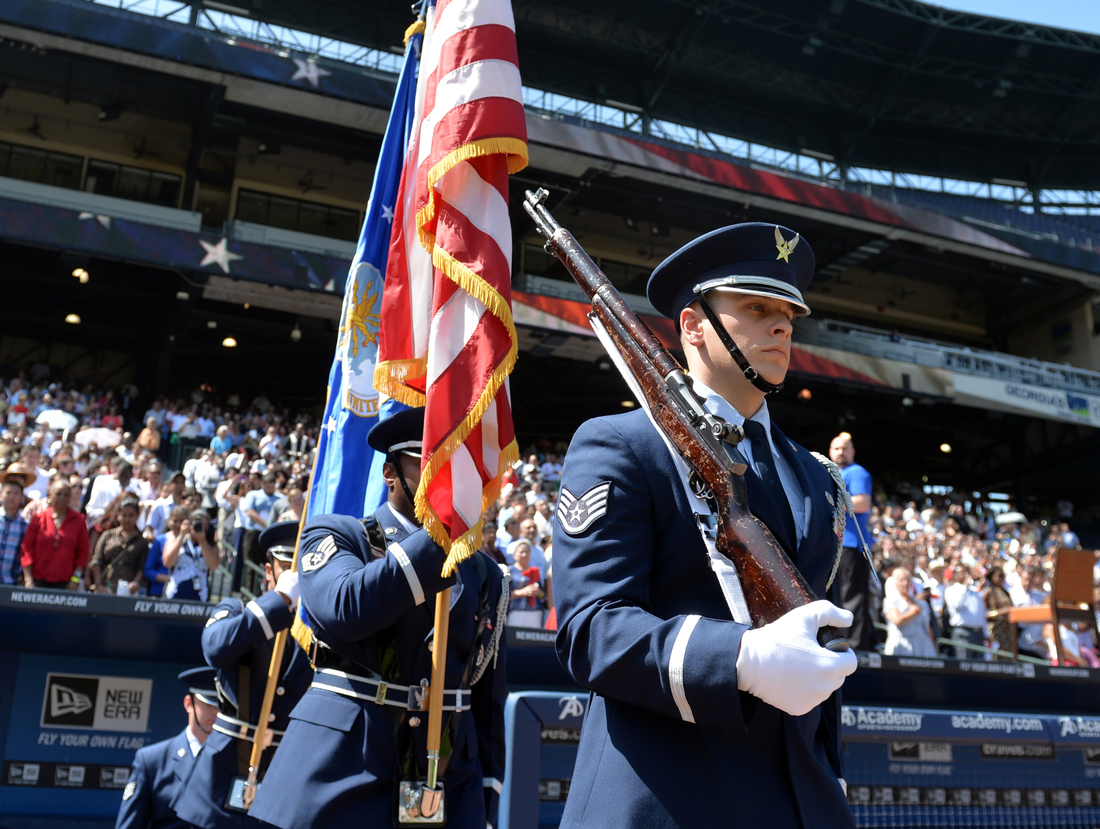Around 1,000 immigrants officially became citizens of the United States during a naturalization ceremony at Turner Field Wednesday July 2, 2014. BRANT SANDERLIN /BSANDERLIN@AJC.COM.