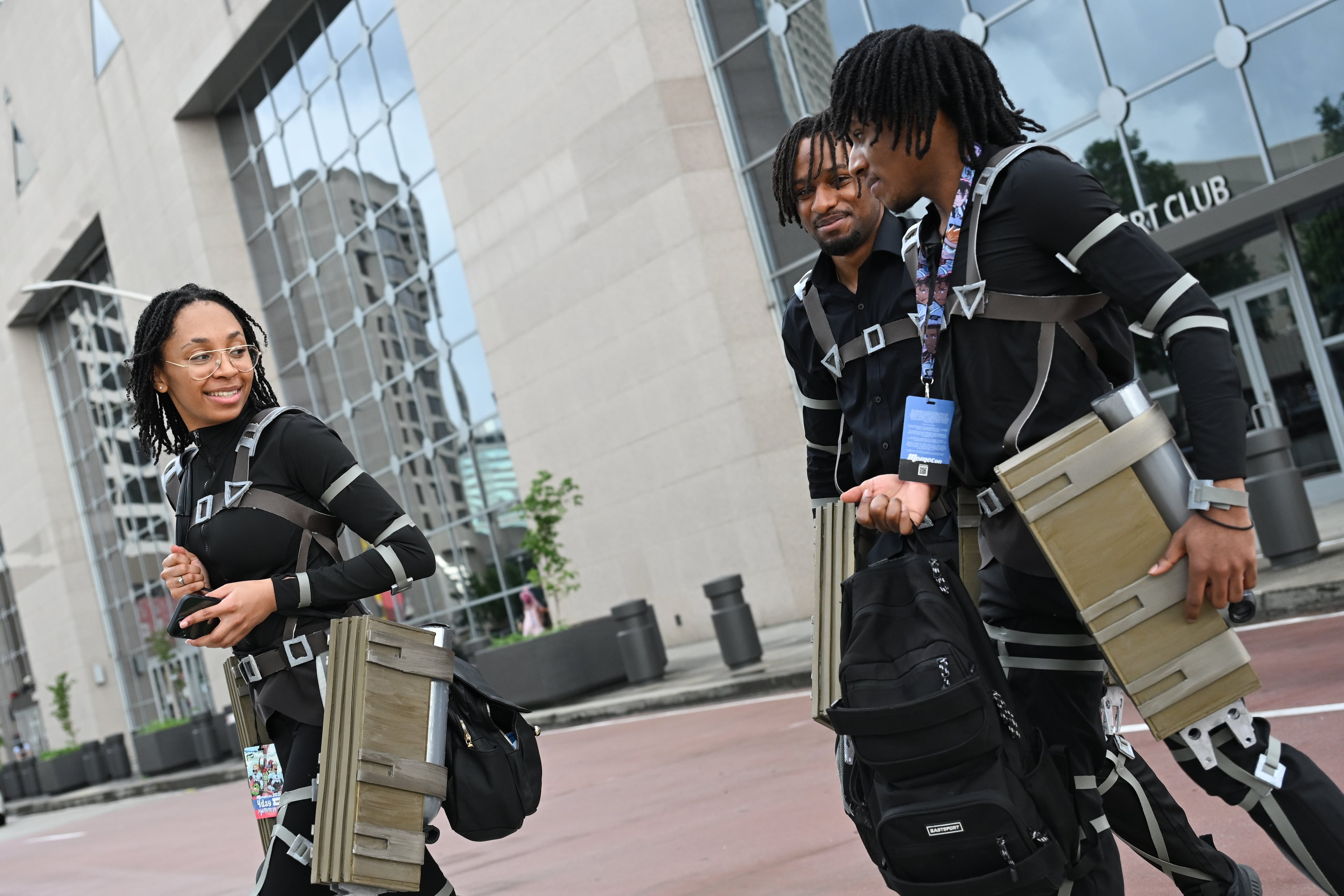 MomoCon attendees, dressed as characters from the Japanese anime and manga series "Attack on Titan," enter the Georgia World Congress Center in Atlanta on Friday, May 22, 2026. (Tyler Sun for the AJC)
