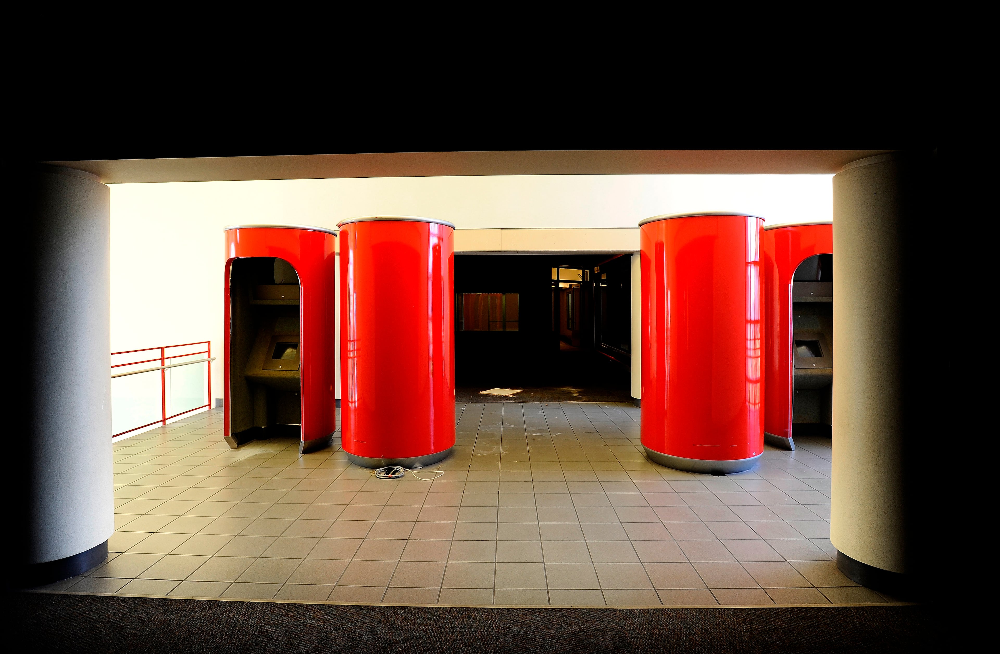 Red cylinders that were part of a museum display remain at the former World of Coca-Cola building in Atlanta on Friday, June 28, 2013, which has been vacant since the soft drink company moved its museum to Centennial Park six years ago. David Tulis / AJC Special