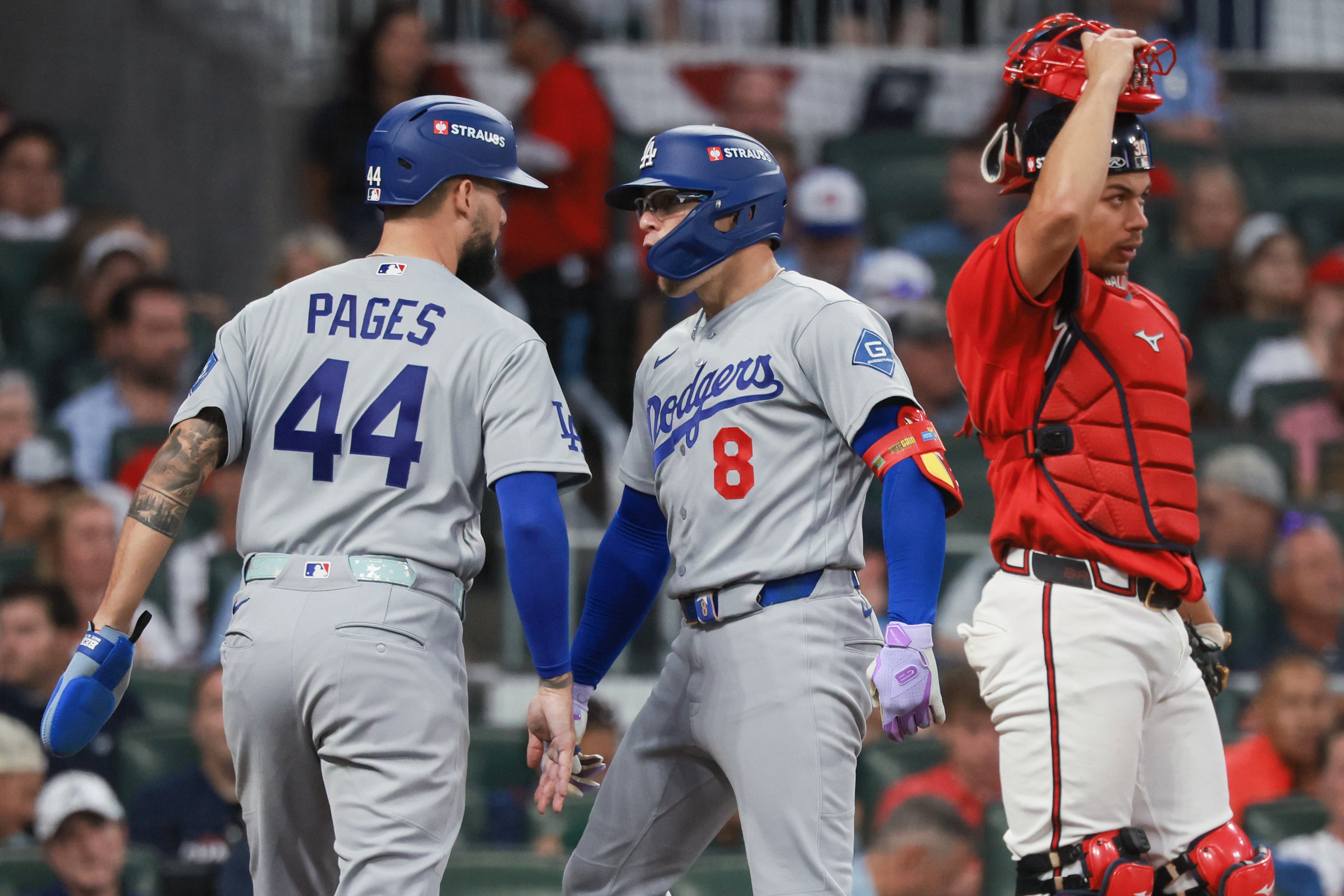 Los Angeles Dodgers' Enrique Hernández (8) celebrates his two-run home run with Andy Pages (44) as Atlanta Braves catcher Drake Baldwin (30) looks on during the fourth inning of Game 3 of the MLB National League Division Series between the Atlanta Braves and the Los Angeles Dodgers, Tuesday, Oct. 6, 2026, in Atlanta. (Jason Getz/AJC)