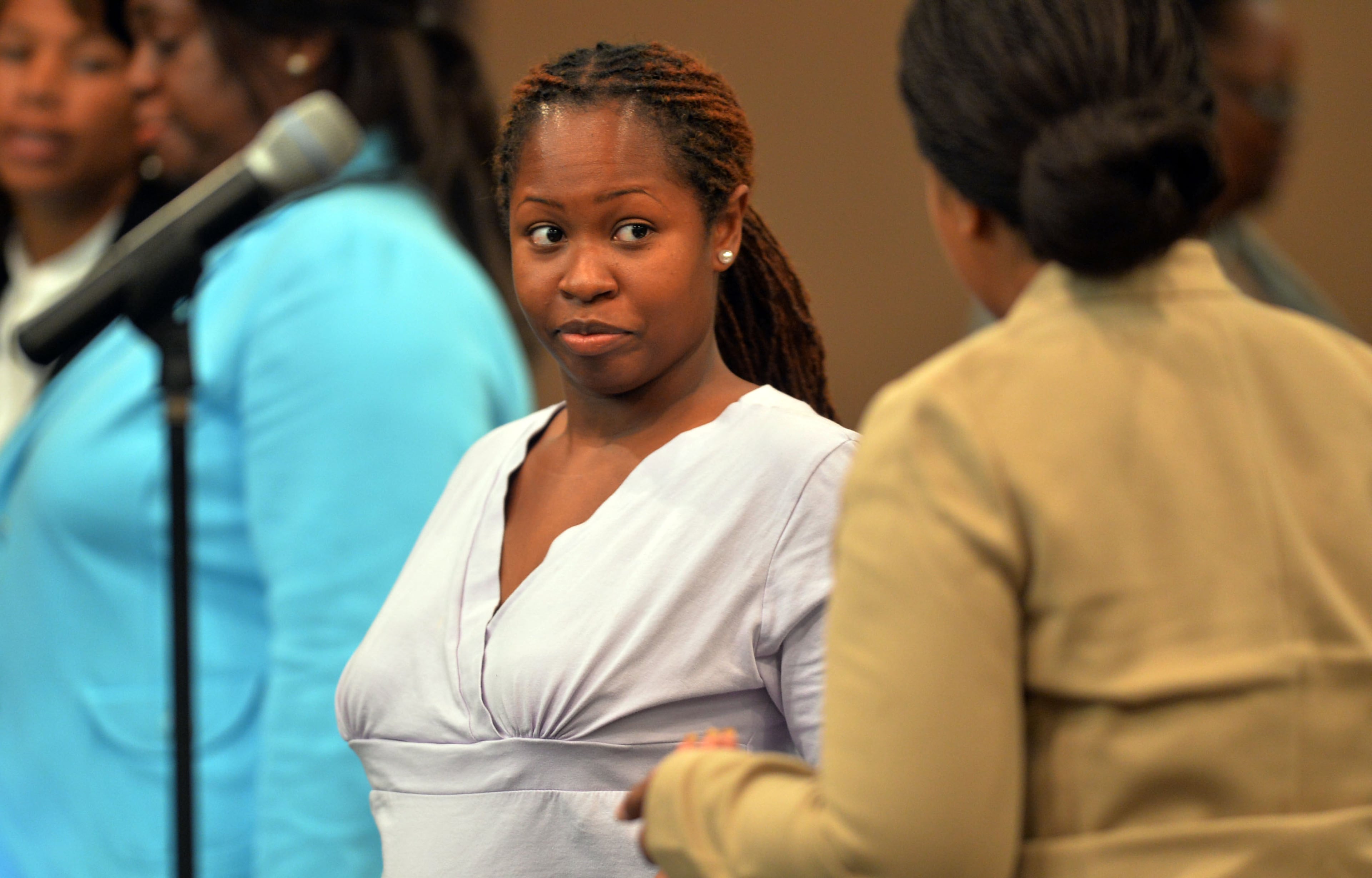 Former APS teacher Shani Robinson talks with her defense attorney Annette Greene after her opening statement Monday afternoon. Defense attorneys begin opening statements Monday afternoon after the prosecution laid out its case during a nearly three-hour-long opening statement to kick off the Atlanta Public Schools test-cheating trial before Judge Jerry Baxter in Fulton County Superior Court, Monday September 29, 2014. Not all 12 defense lawyers will be making opening statements; some are planning to reserve theirs until after the prosecution presents its case. KENT D. JOHNSON / KDJOHNSON@AJC.COM