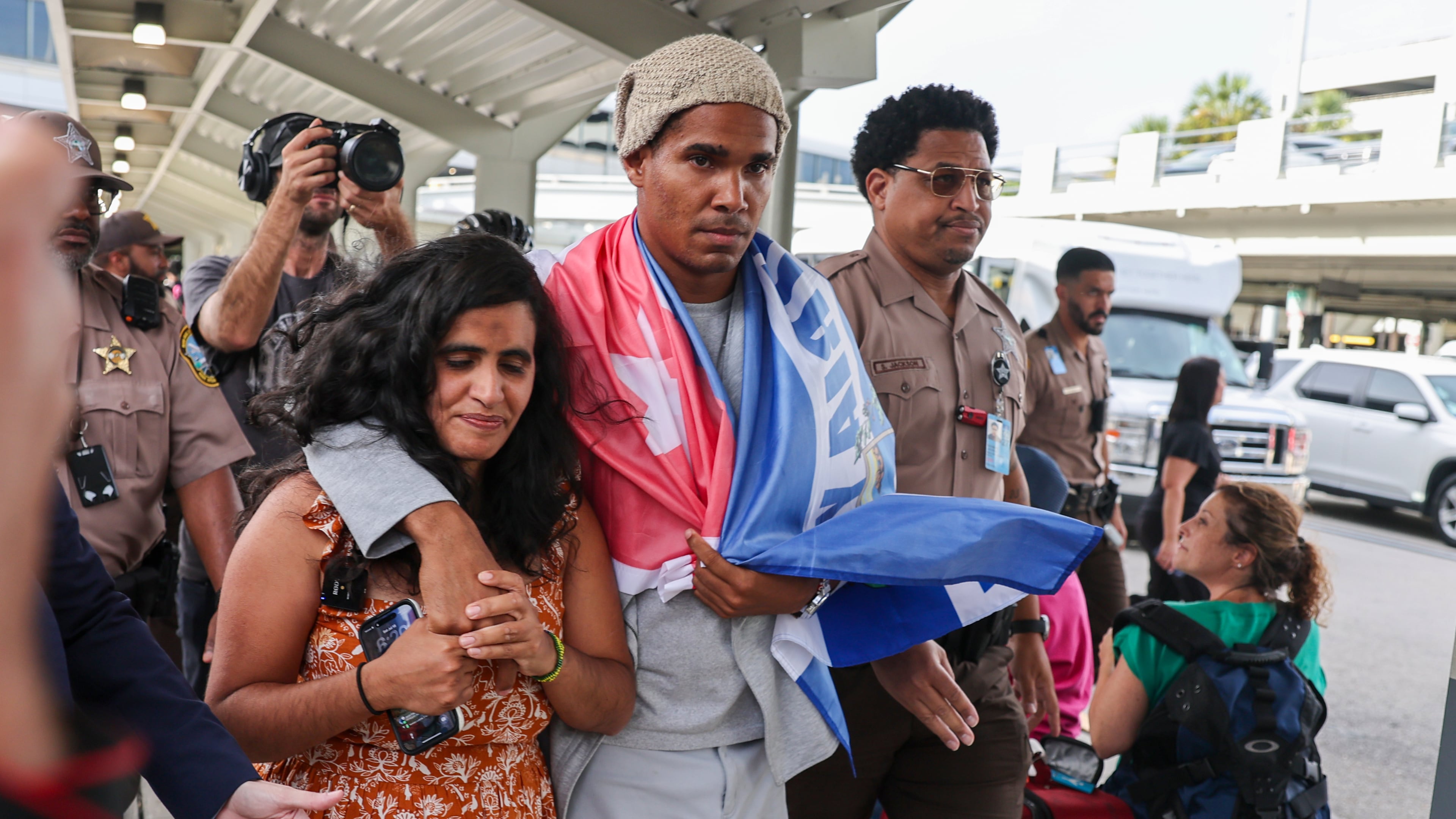 Cuban dissident artist Luis Manuel Otero Alcántara arrives at Miami International Airport on Saturday, July 18, 2026, after serving a five-year prison sentence in Cuba. (AP Photo/David Santiago)