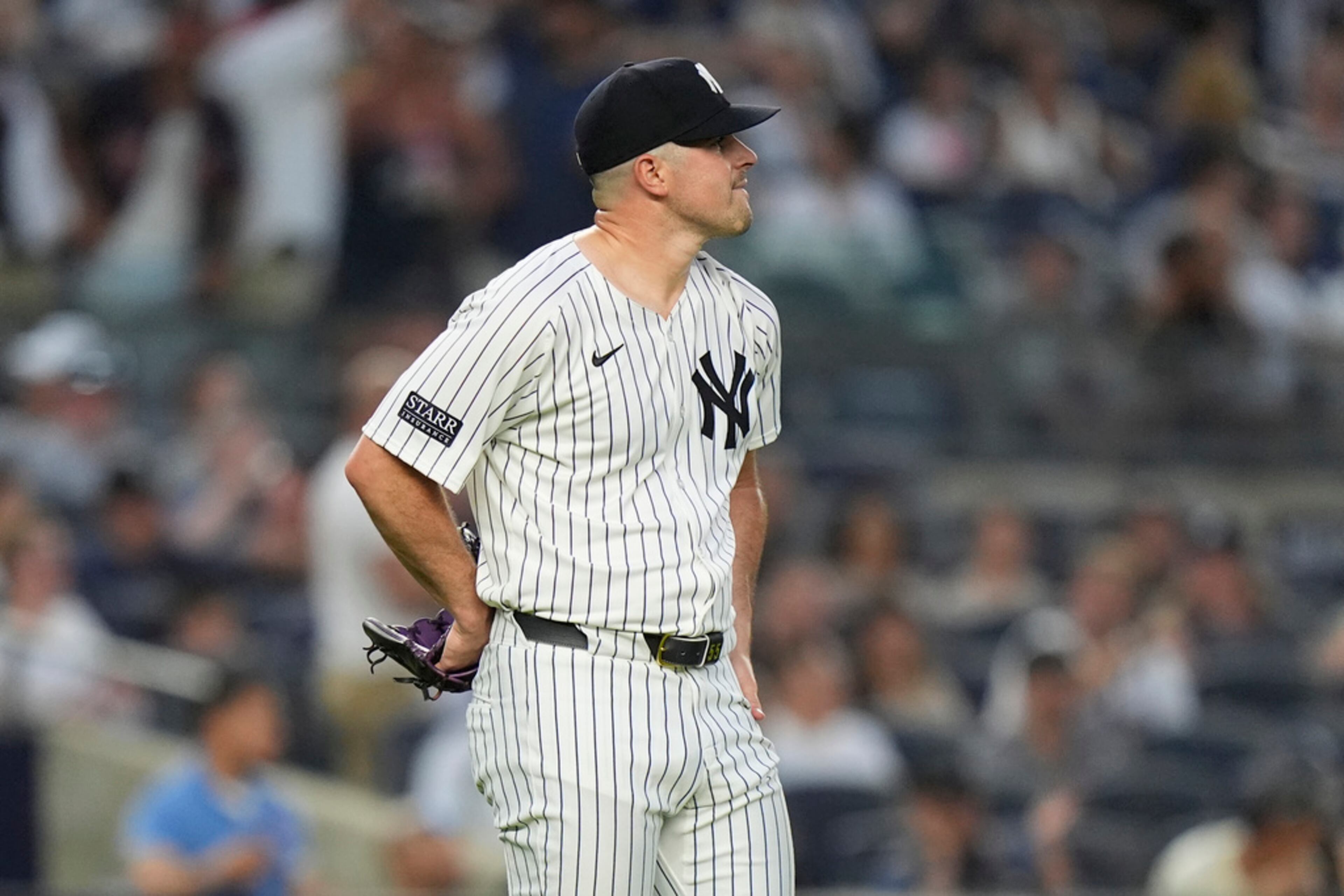New York Yankees pitcher Carlos Rodón watches a two-run home run by Atlanta Braves' Matt Olson during the fourth inning of a baseball game, Friday, June 21, 2024, in New York. (AP Photo/Frank Franklin II)