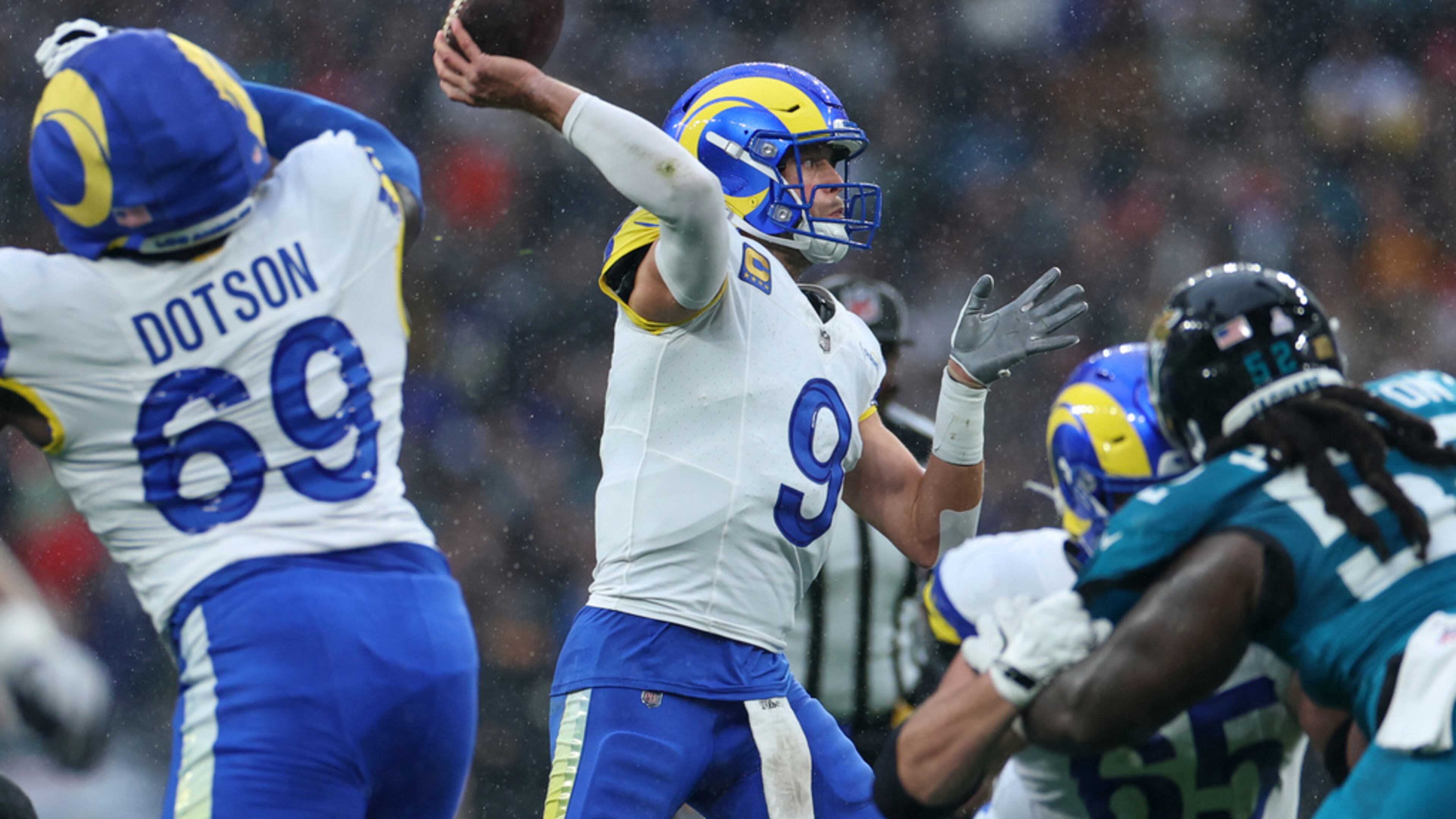 Los Angeles Rams quarterback Matthew Stafford (center) passes the ball during the first half against the Jacksonville Jaguars on Sunday, Oct. 19, 2025, in London. Stafford was 21-of-33 passing for 182 yards, despite less-than-ideal conditions. (Ian Walton/AP)