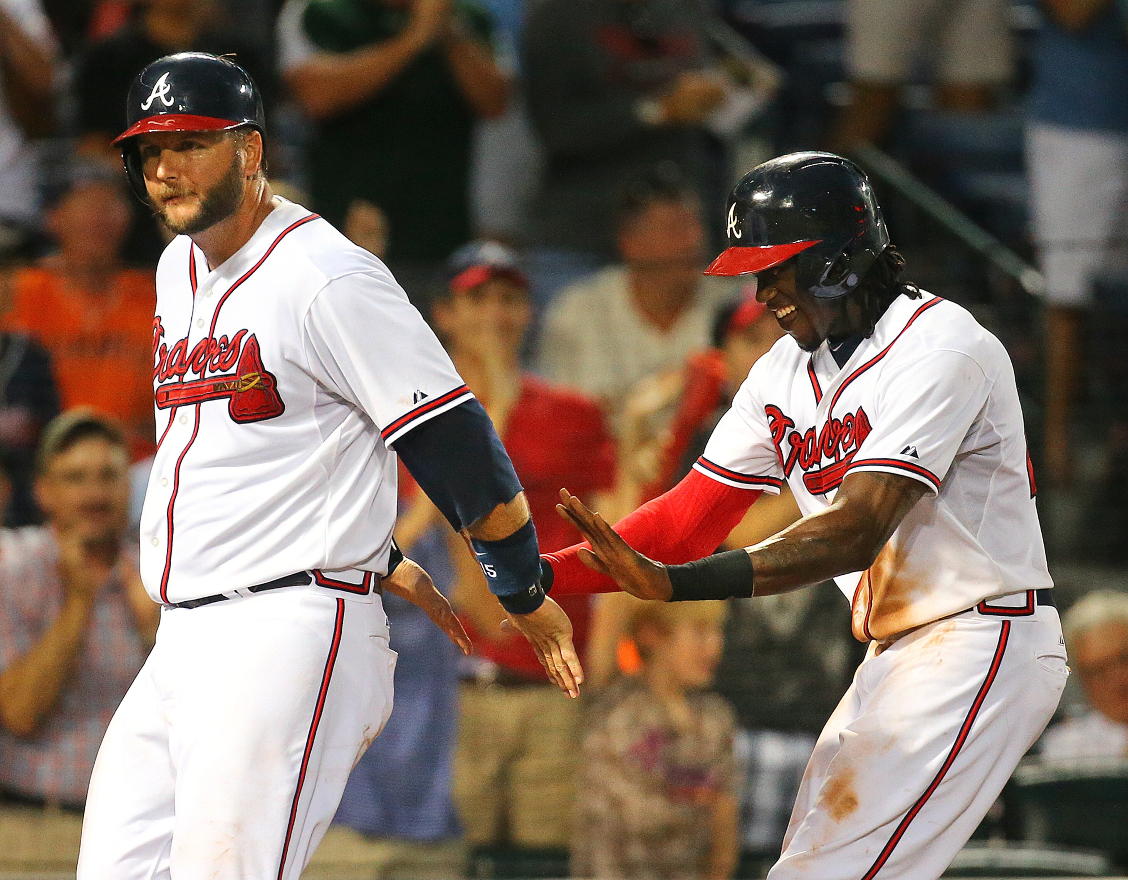 Number 27: Back in it -- A. J. Pierzynski (left) and Cameron Maybin celebrate after scoring on August 3. Photo by Curtis Compton.