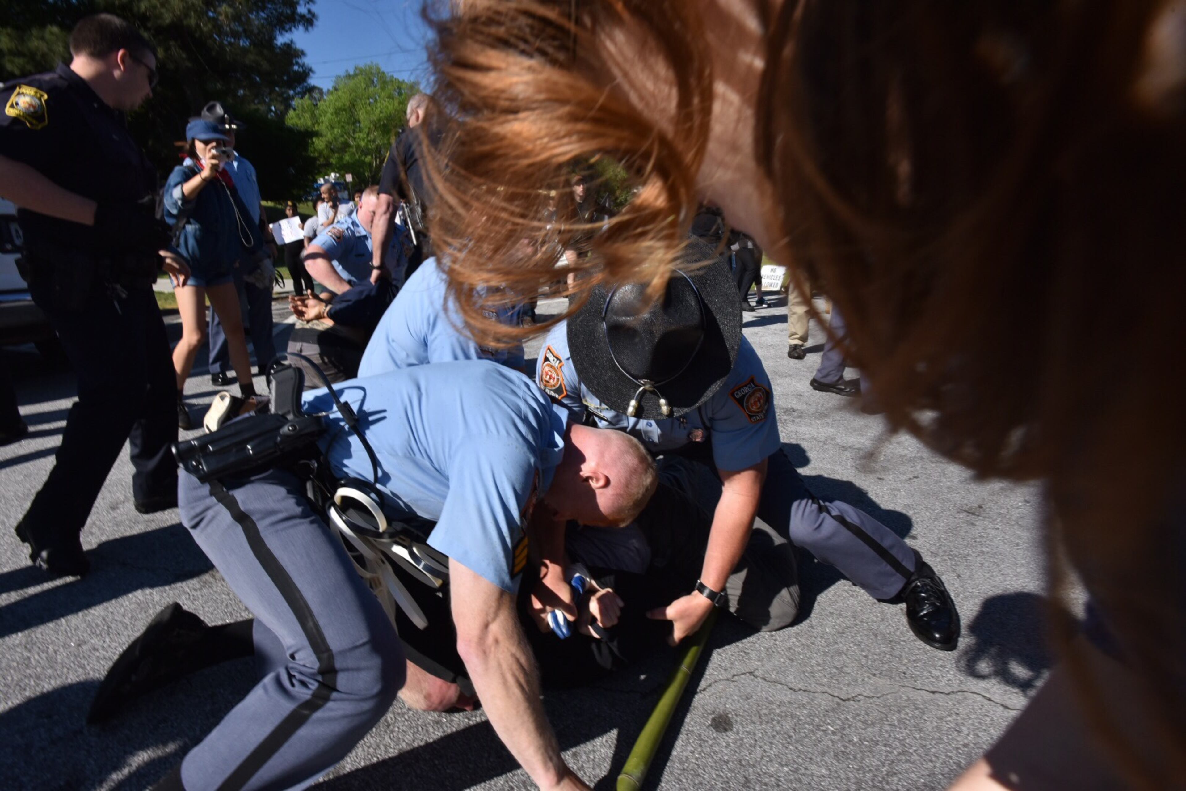 Protesters clash with police near a “white power” rally in Stone Mountain on Saturday, April 23, 2016. The protesters said they are opposing the message of hate at the supremacist rally also taking place at the park.