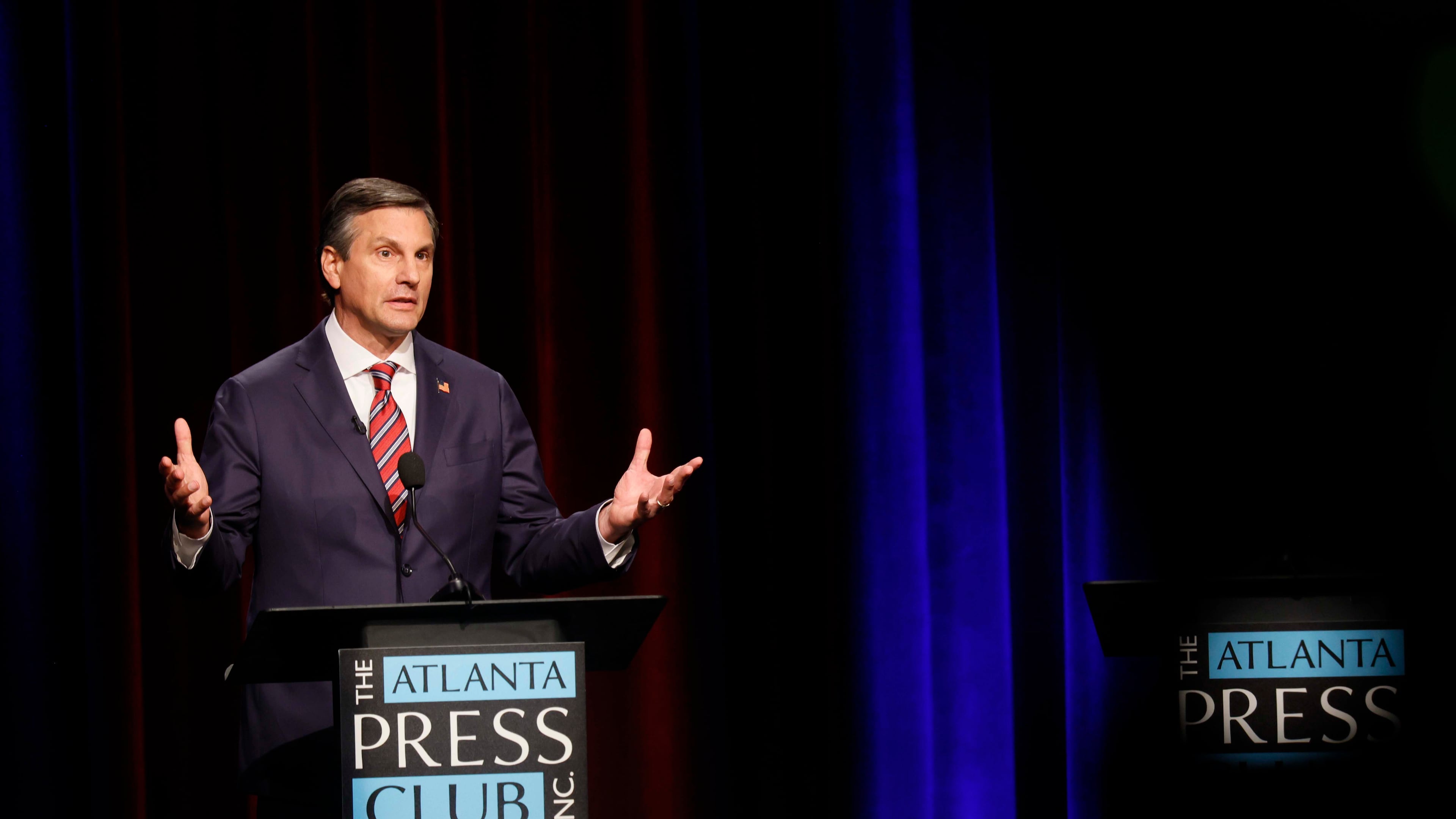 Former football coach Derek Dooley a Republican candidate for the U.S. Senate responds to a question at the Atlanta Press Club Loudermilk-Young debate for the U.S. Senate at Georgia Public Broadcasting in Midtown on Sunday, April 26, 2026. (Miguel Martinez/AJC)