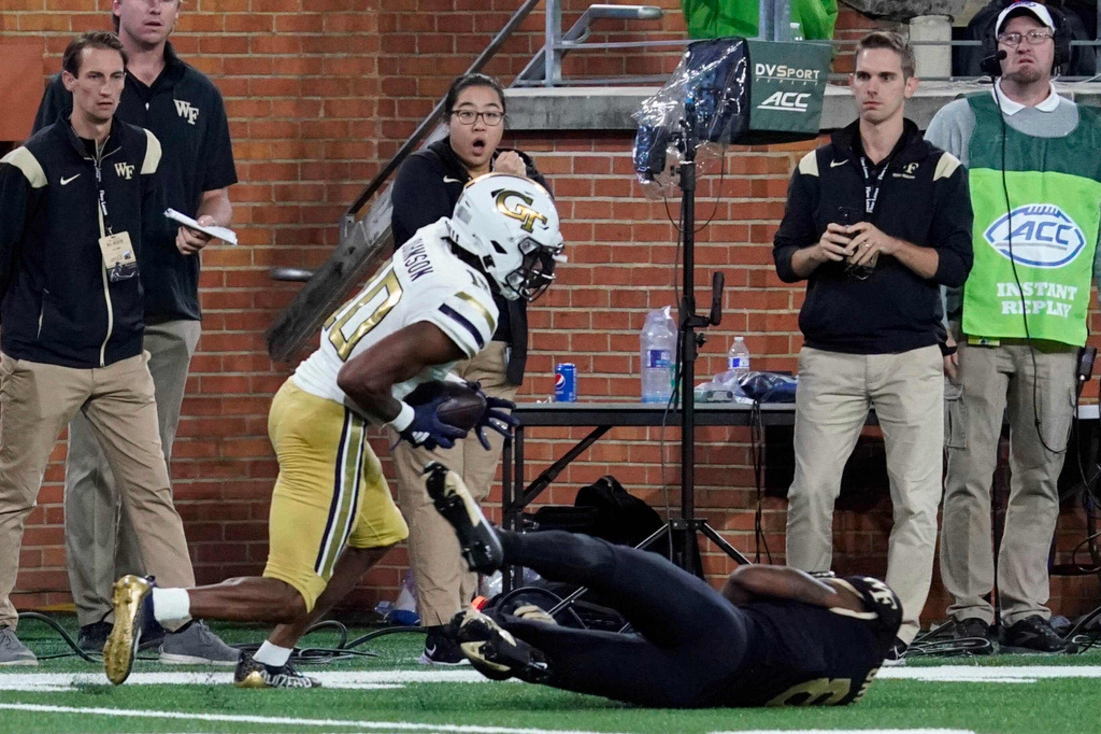 Georgia Tech defensive back Kenan Johnson, left, intercepts a pass intended for Wake Forest wide receiver Wesley Grimes during the second half of an NCAA college football game in Winston-Salem, N.C., Saturday, Sept. 23, 2023. (AP Photo/Chuck Burton)