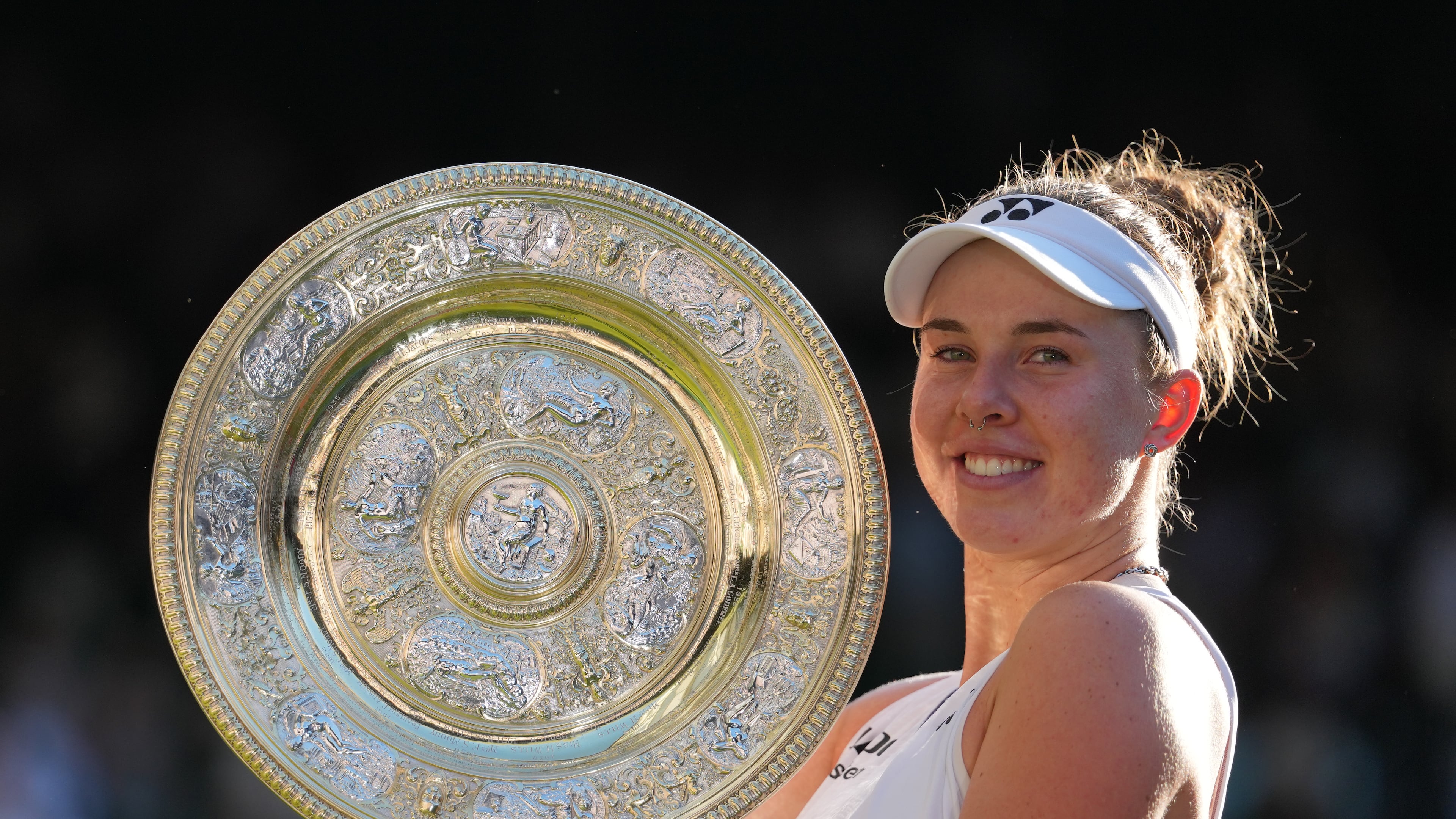 FILE - Linda Noskova of the Czech Republic poses with the trophy after winning against Karolina Muchova of the Czech Republic in the women's singles final at Wimbledon Tennis Championships in London, July 11, 2026. (AP Photo/Kirsty Wigglesworth, File)