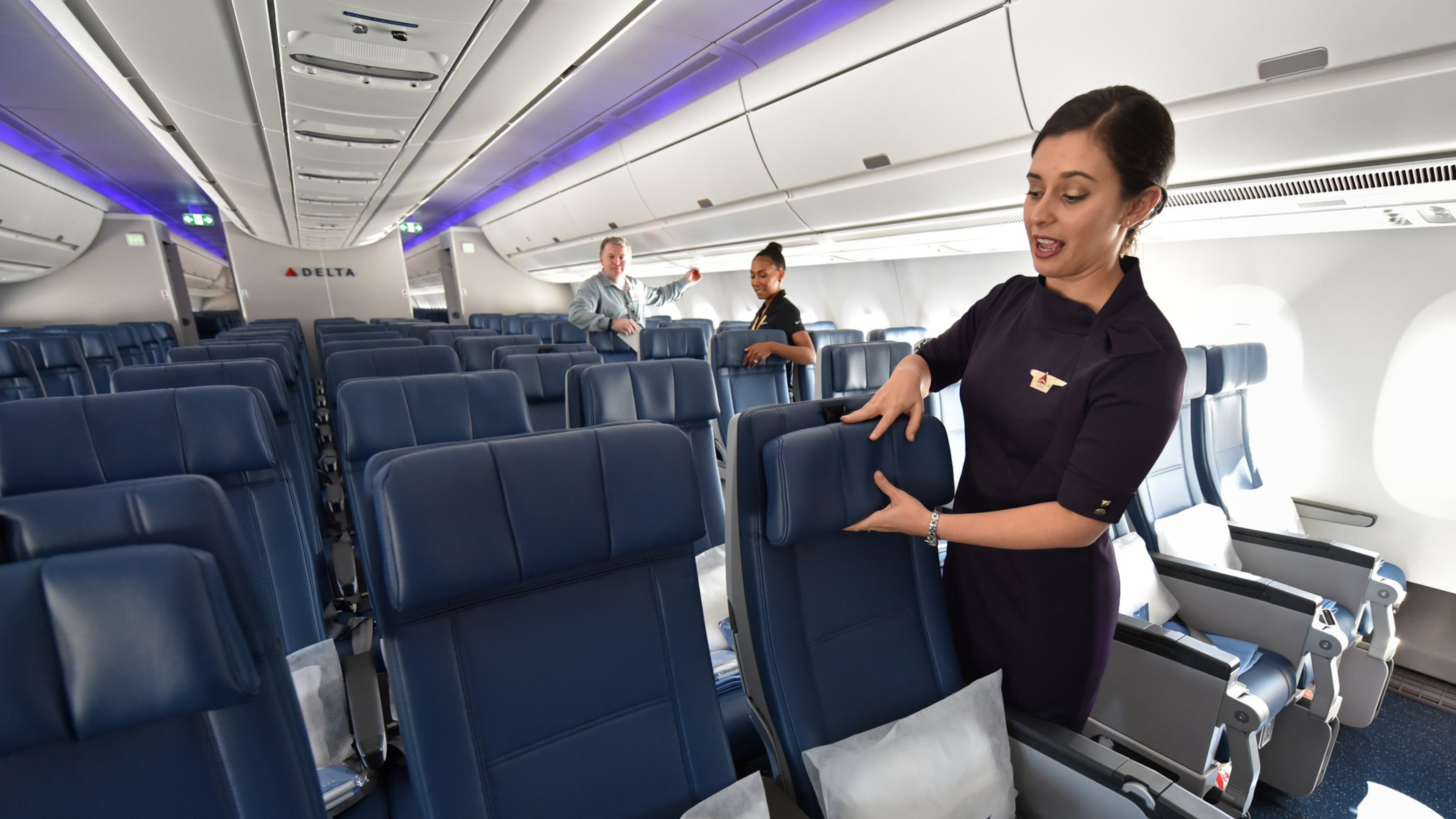 Kori Chapman, flight attendant, shows Airbus A350’s main cabin during a media event at Hartsfield-Jackson International Airport on Tuesday, October 17, 2017. HYOSUB SHIN / HSHIN@AJC.COM