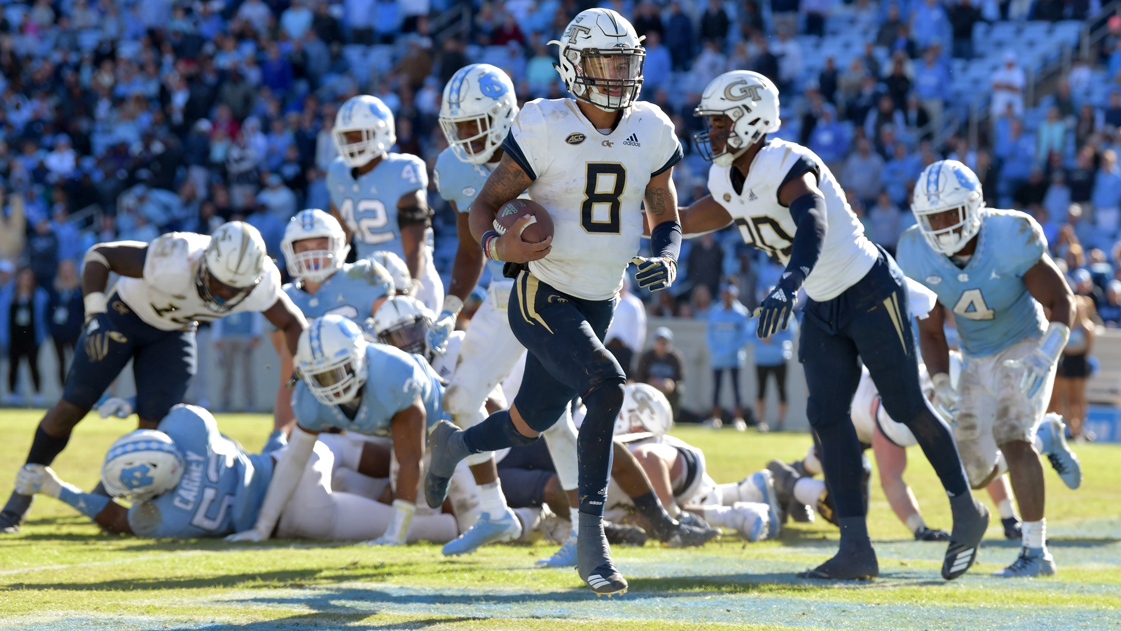 CHAPEL HILL, NC - NOVEMBER 03: Tobias Oliver #8 of the Georgia Tech Yellow Jackets scores the go-ahead touchdown against the North Carolina Tar Heels during the fourth quarter of their game at Kenan Stadium on November 3, 2018 in Chapel Hill, North Carolina. Georgia Tech won 38-28. (Photo by Grant Halverson/Getty Images)
