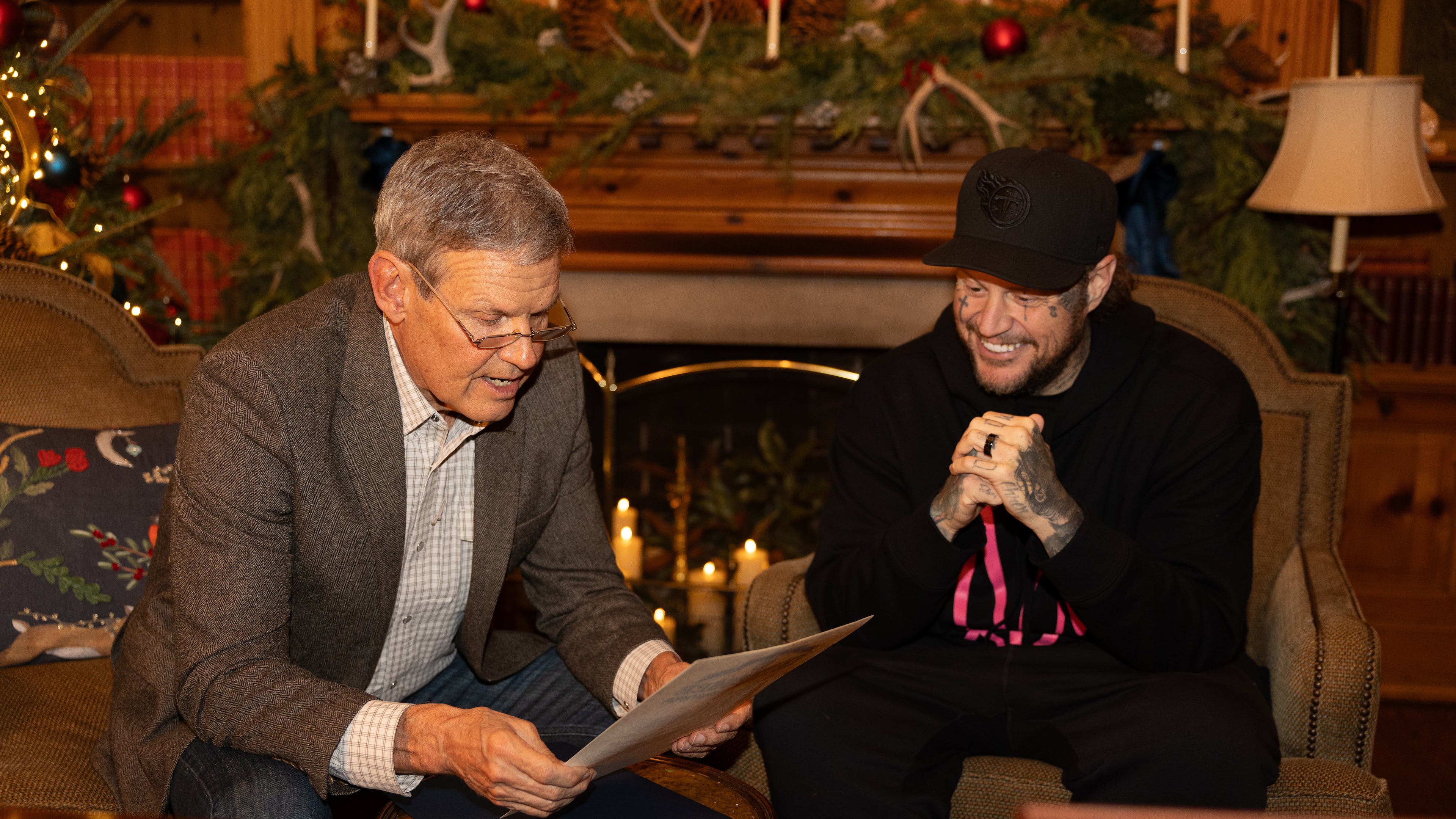 This photo provided by the office of Tennessee Gov. Bill Lee shows Gov. Bill Lee, left, giving country musician Jelly Roll news of his official pardon Thursday, Dec. 18, 2025, at the Tennessee Governor's Mansion in Oak Hill, Tenn. (Brandon Hull/Office of Gov. Bill Lee via AP)