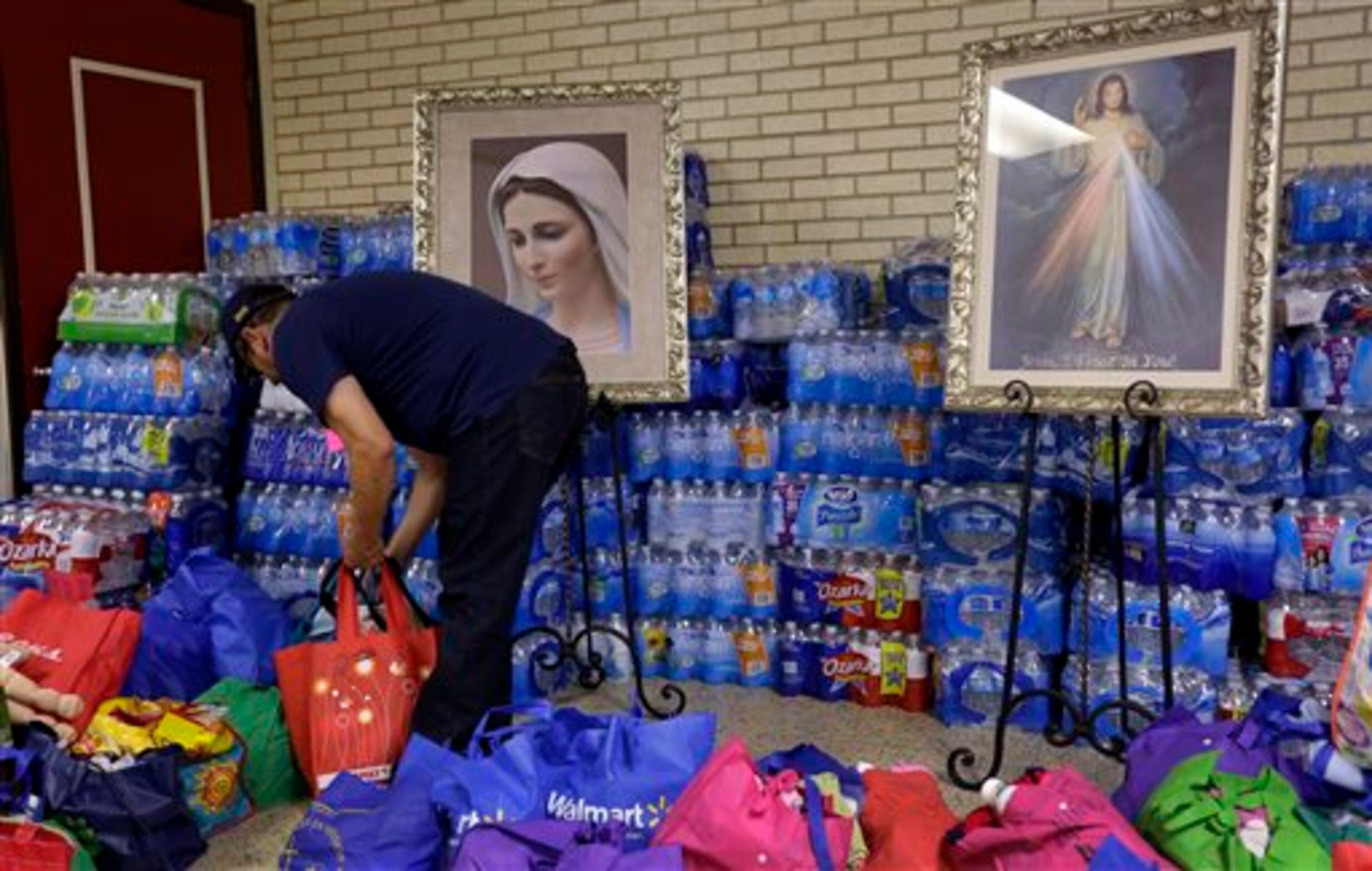 In this June 20, 2014 photo, donated items for immigrant families who have crossed the U.S.-Mexico border illegally are arranged at the Sacred Heart Catholic Church in McAllen, Texas. Just since October, the Border Patrol's Rio Grande Valley sector has made more than 194,000 arrests, nearly triple that of any other sector. Most are from Central America, and many are children. (AP Photo/Eric Gay)