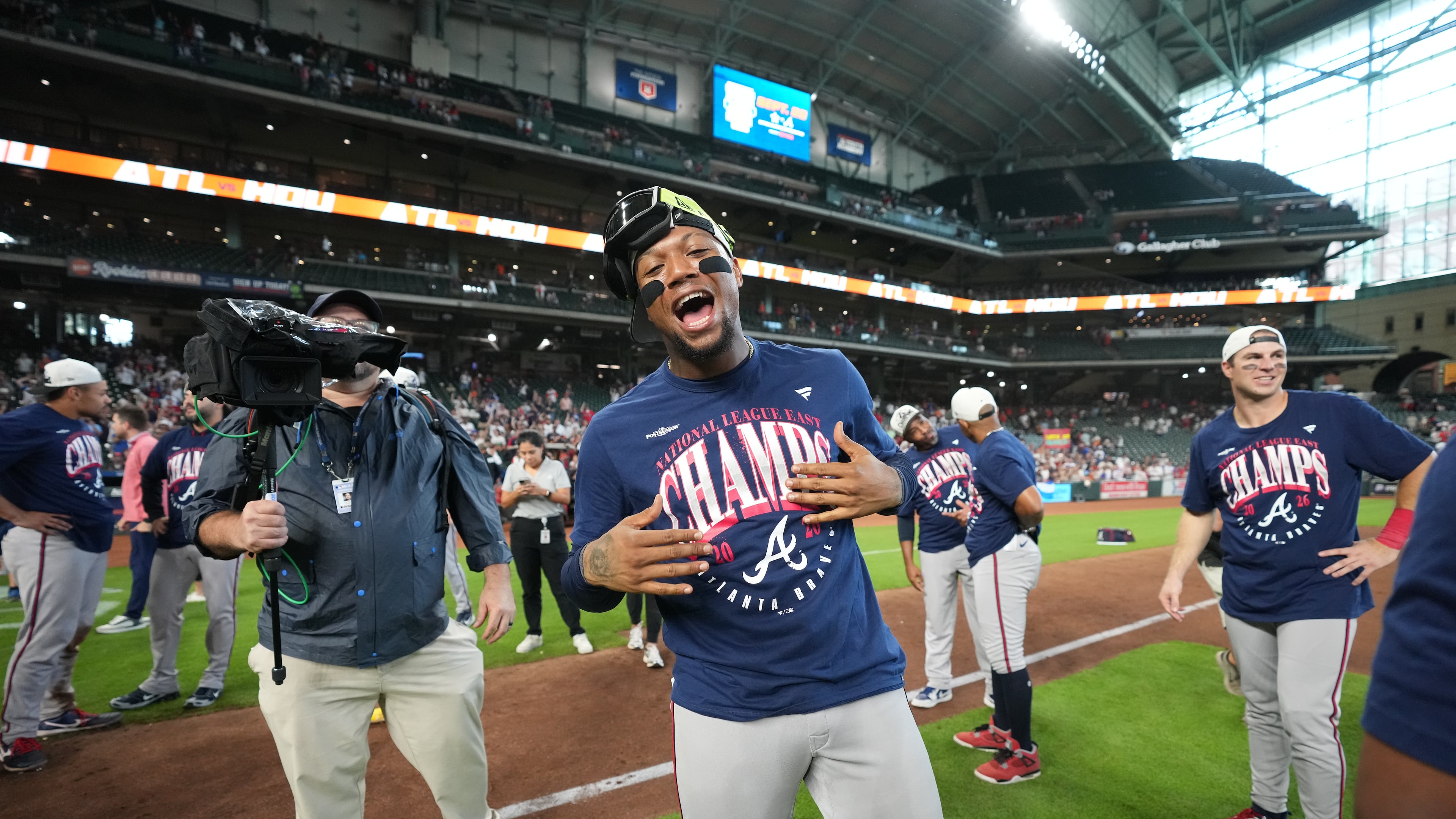 Atlanta Braves' Ronald Acuña Jr. (center) celebrates on the field after a game against the Houston Astros as the Braves clinches the NL East title, Sunday, Sept. 20, 2026, in Houston. (Karen Warren/AP)