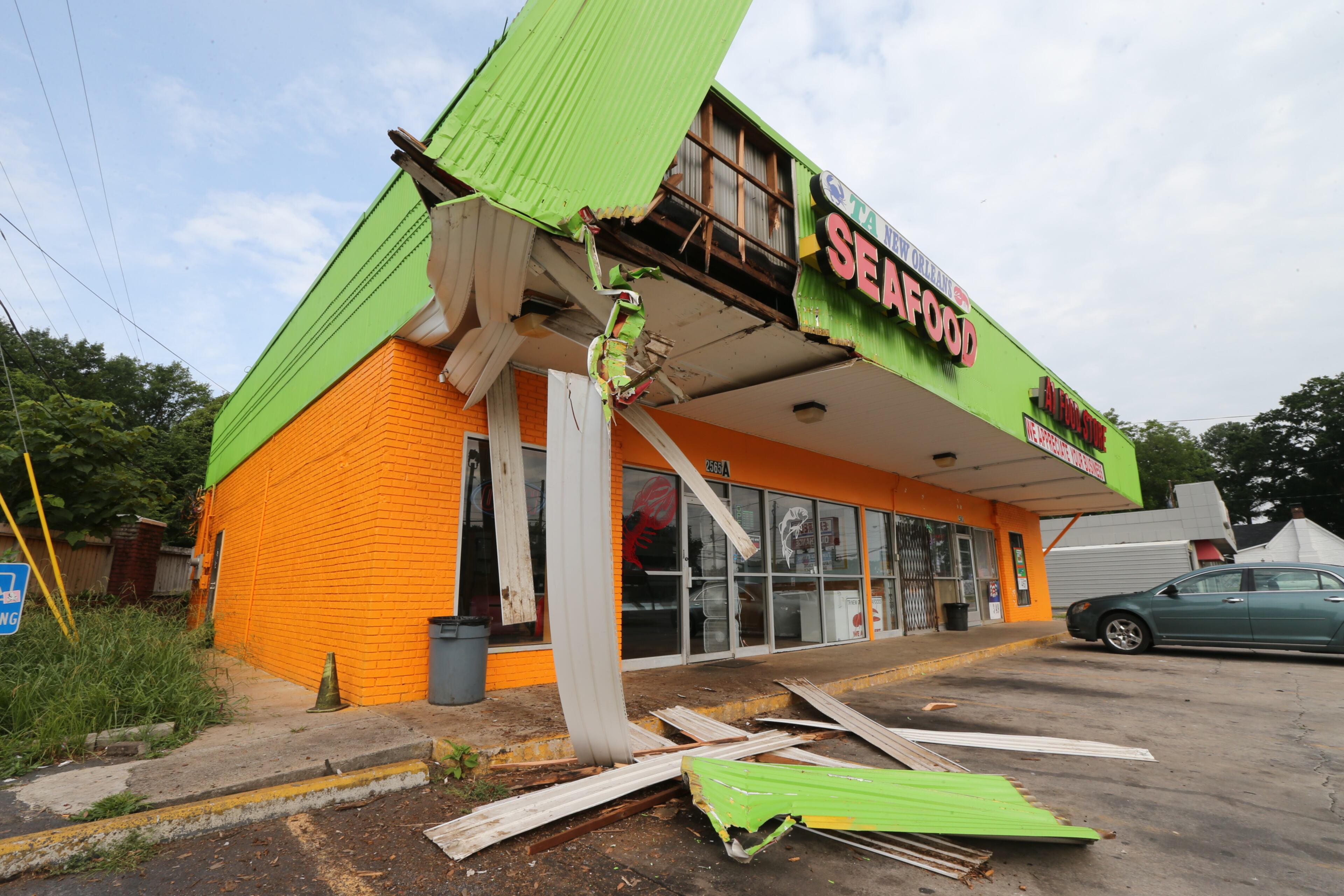 A Candler Road seafood restaurant was damaged Friday morning when a delivery truck ran into the front of the building. JOHN SPINK/JSPINK@AJC.COM