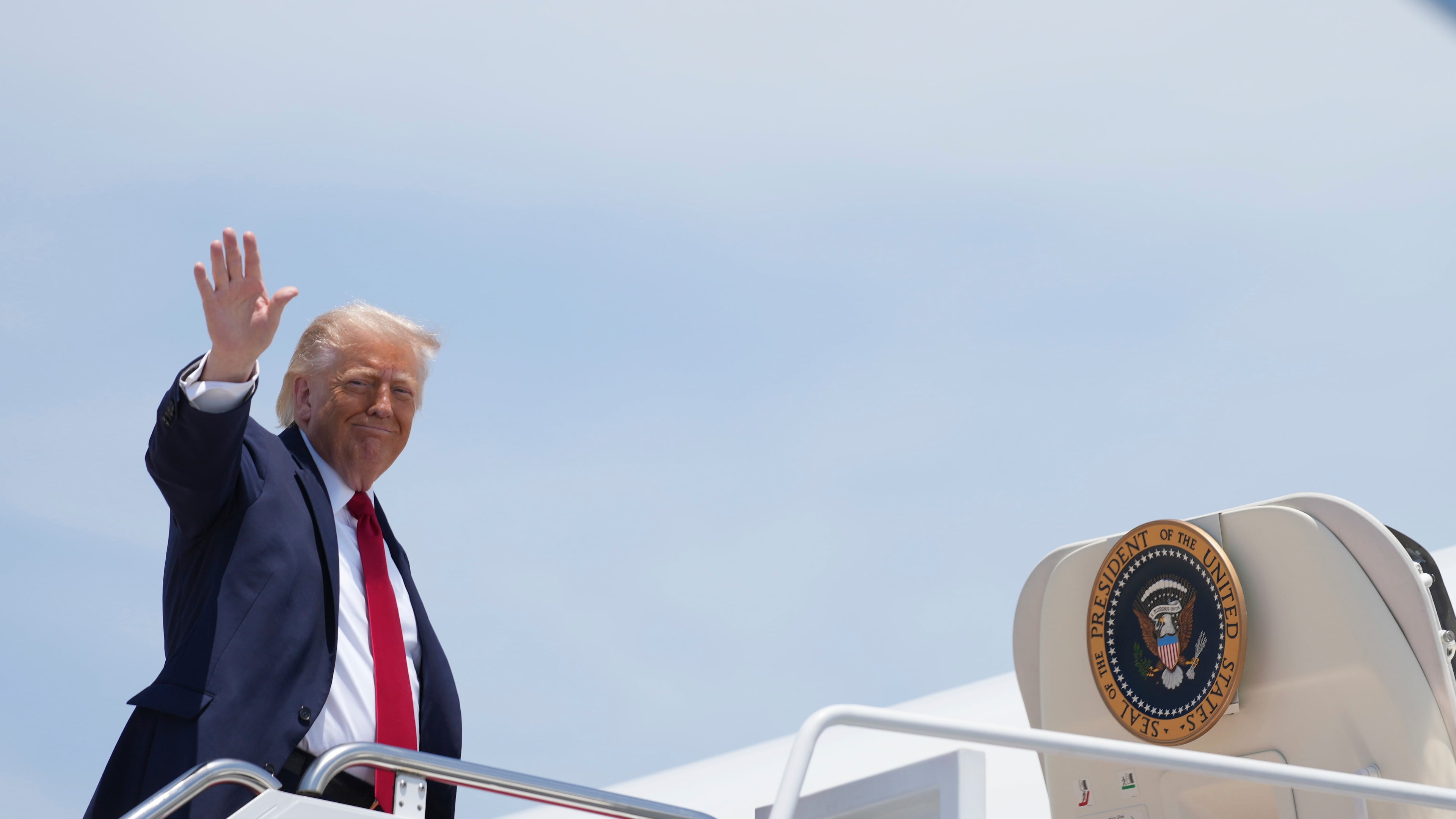 President Donald Trump waves as he boards Air Force One, Friday, June 5, 2026, at Joint Base Andrews, Md. (AP Photo/Mark Schiefelbein)