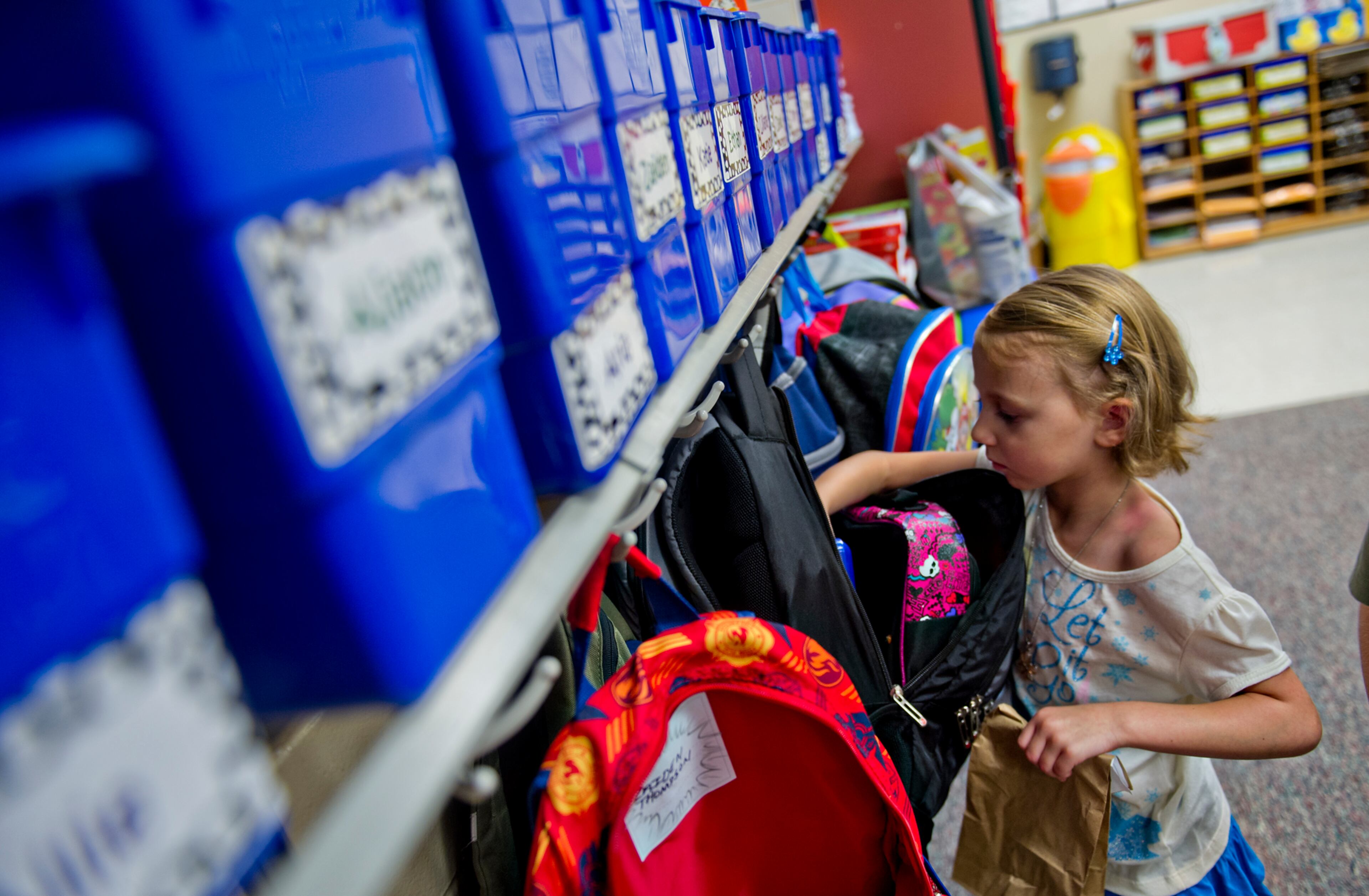 Liliana Remenih pulls her lunch out of her backpack during the first day of classes at Davis Elementary School in Marietta on Monday, August 4, 2014. Teachers and administrators at the school dressed as pirates for the first day of school. Students in Cobb County and Atlanta public schools headed back to class on Monday for the new school year. JONATHAN PHILLIPS / SPECIAL