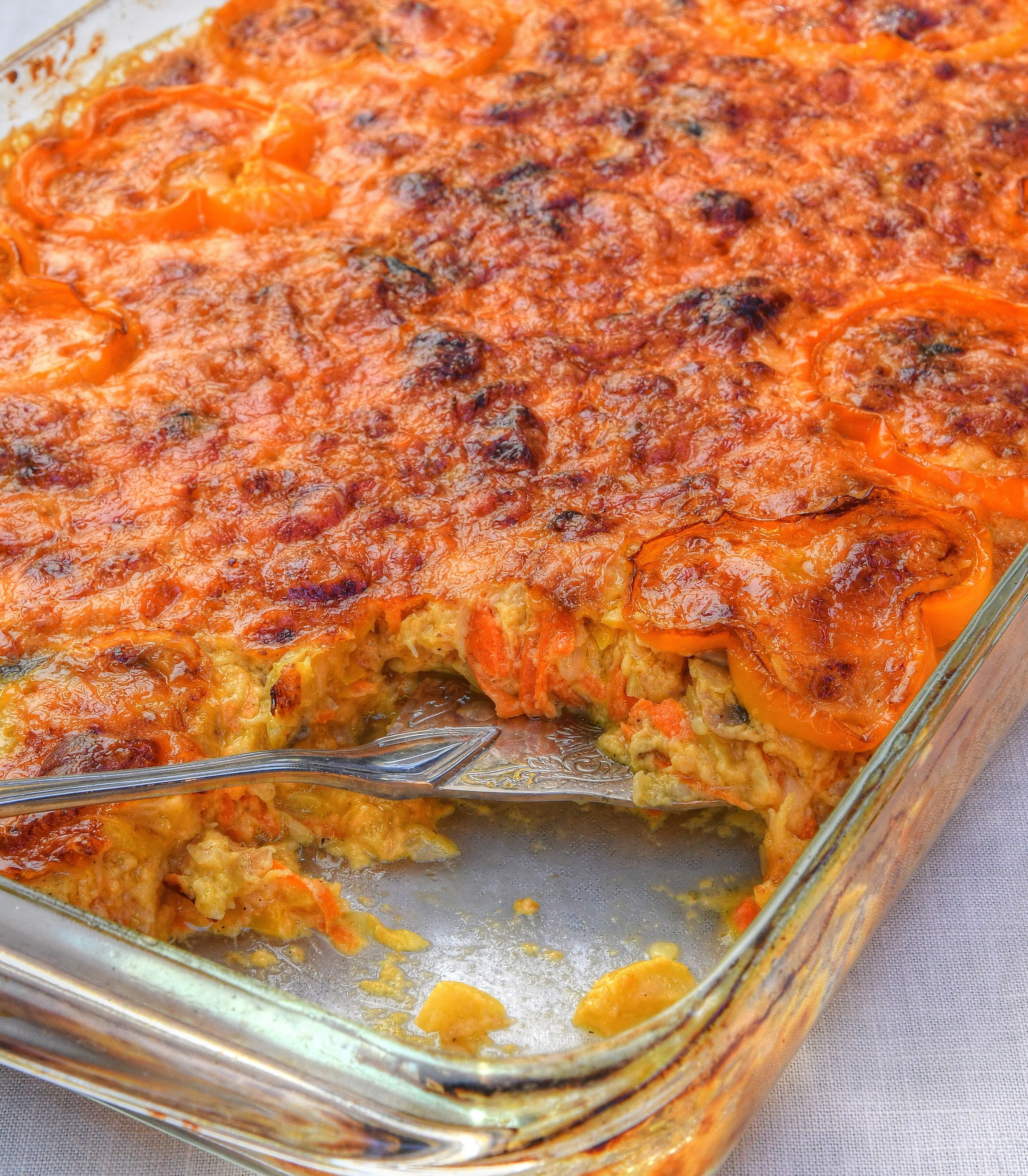 Wendell Brock's recipe for Cheesy Squash Casserole makes mushrooms optional, and the colors of the bell peppers match the season, with yellow and orange for Thanksgiving. (Styling by Ligaya Figueras / Chris Hunt for the AJC)