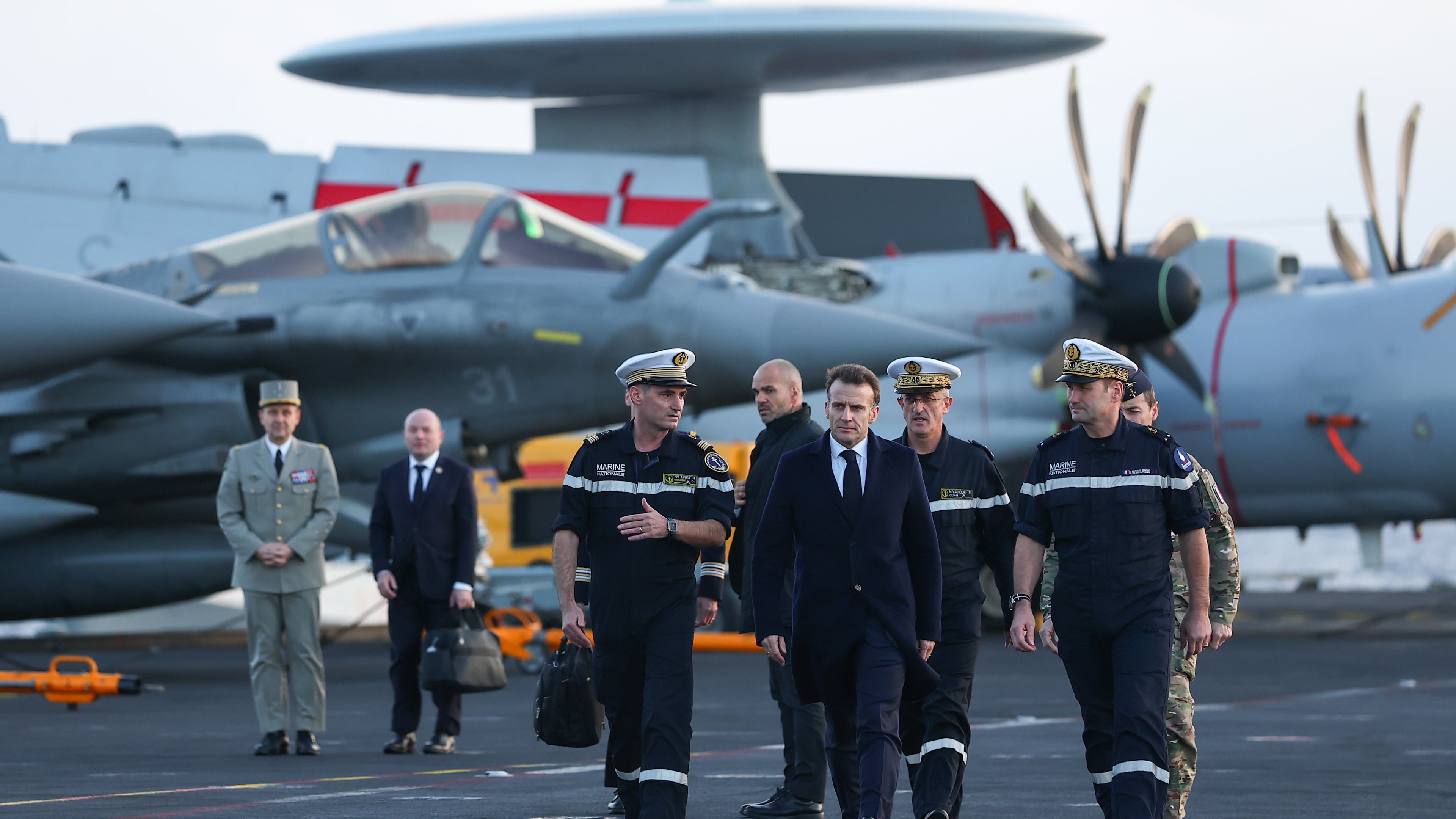 FILE - French President Emmanuel Macron, center right, visits the French aircraft carrier Charles de Gaulle, during his visit to Cyprus, March 9, 2026. (Gonzalo Fuentes/Pool Photo via AP, File)